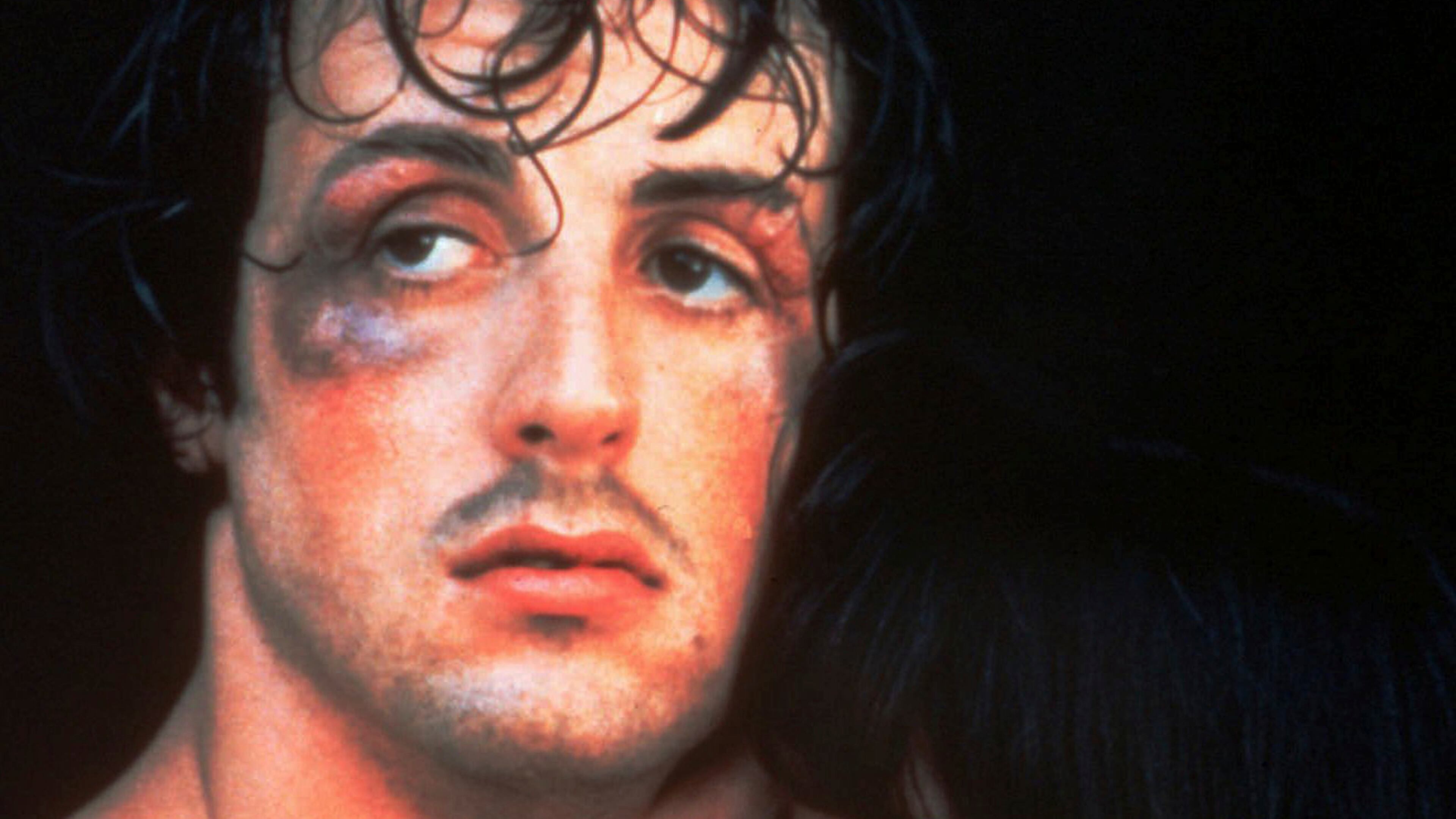 Actor and screenwriter Sylvester Stallone holds actress Talia Shire in a scene from the 1976 movie “Rocky.” (AP Photo, File)