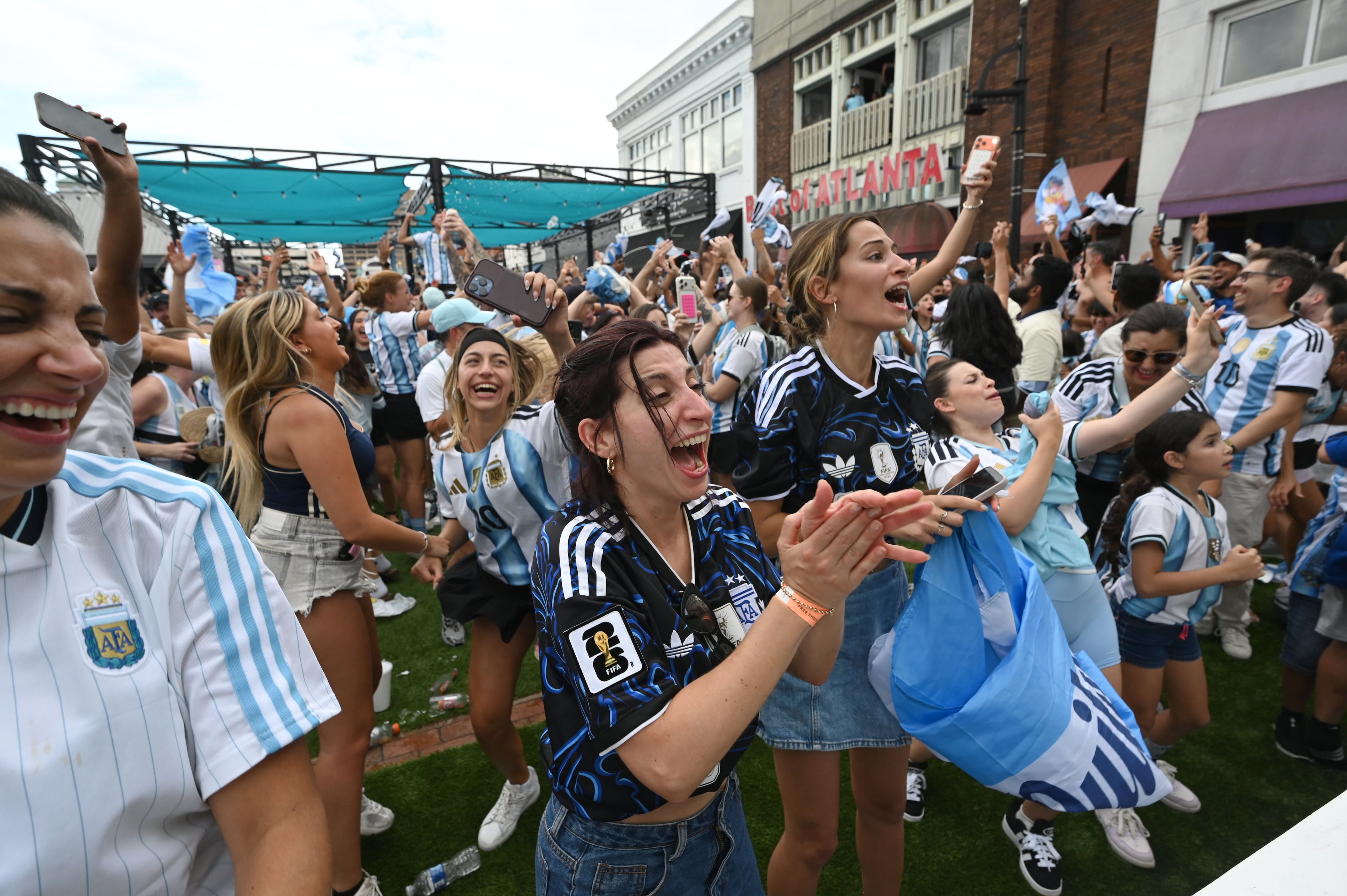 Argentina fans celebrate their win at the end of the game as they gather at Underground Atlanta to watch the FIFA World Cup semifinal between Argentina and England on Wednesday, July 15, 2026, in Atlanta. (Hyosub Shin/AJC)