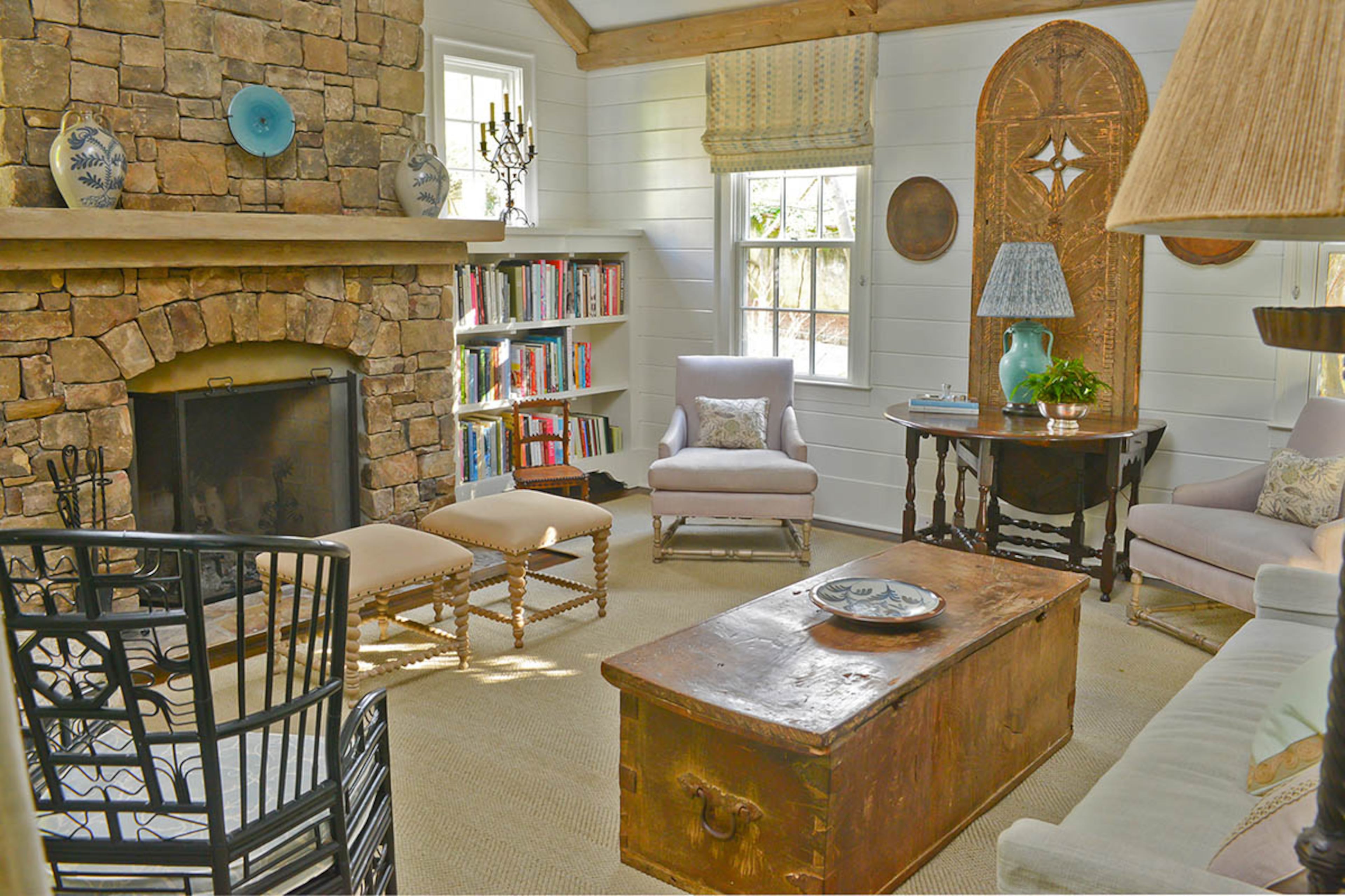 In 2015, Johnson worked with architect William B. Litchfield and contractor Curtis Carden to renovate and redesign her Buckhead home. In the family room, she added two small windows on either side of the fireplace to bring in more natural light, then placed bookshelves beneath the windows for storage.