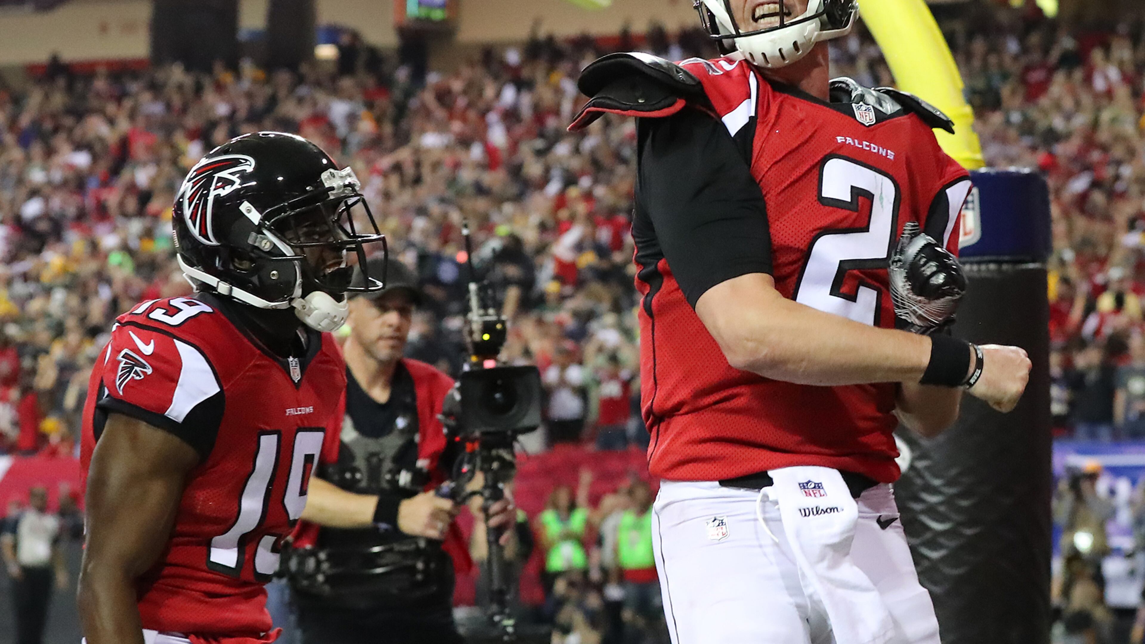 Falcons quarterback Matt Ryan celebrates after scoring on a 14-yard touchdown run in the second quarter. The Falcons beat Green Bay in the NFC title game to advance to the Super Bowl for only the second time. (Curtis Compton/ccompton@ajc.com_
