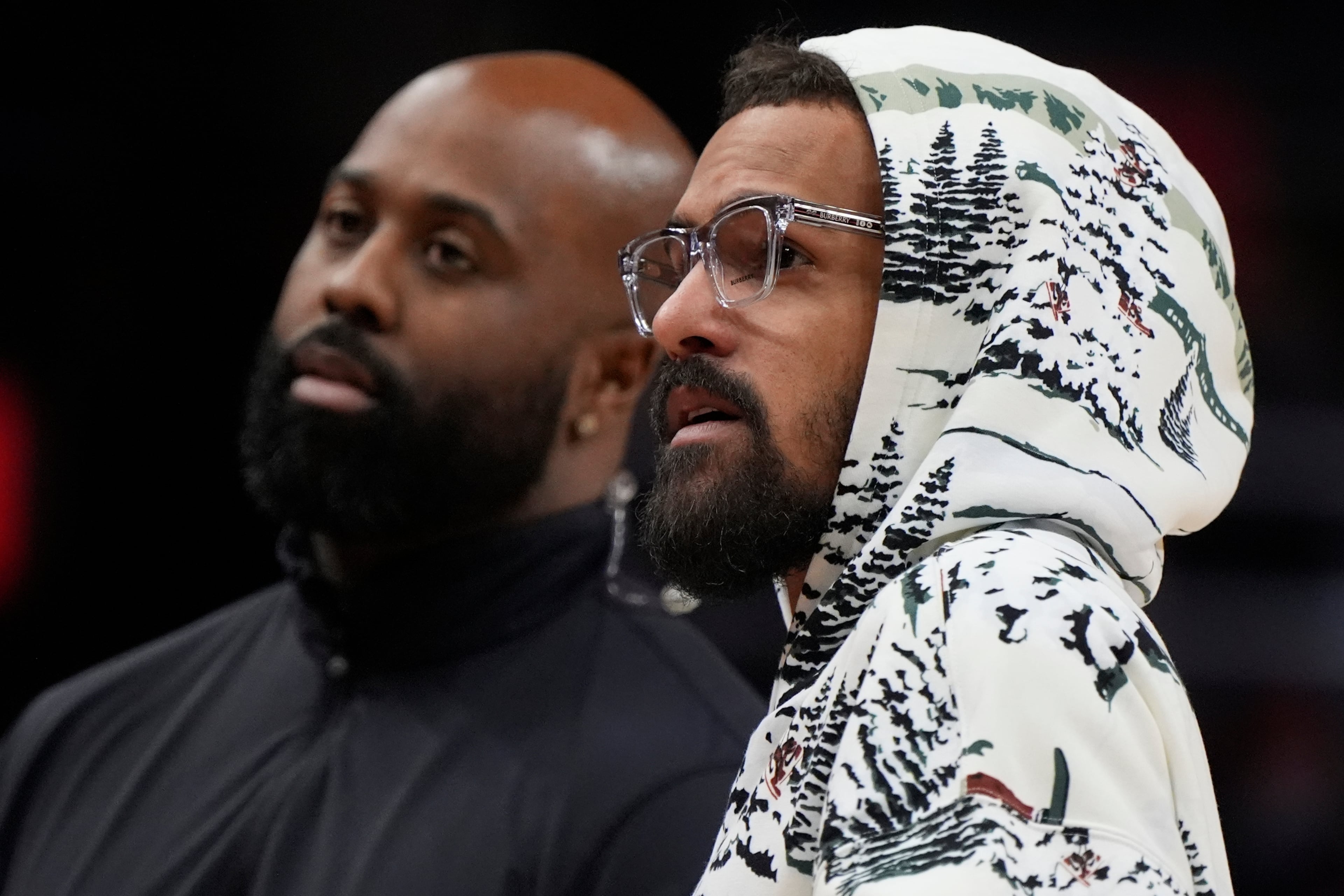 Contrary to popular belief, Trae Young is not being shopped because he stole coach Quin Snyder's glasses.