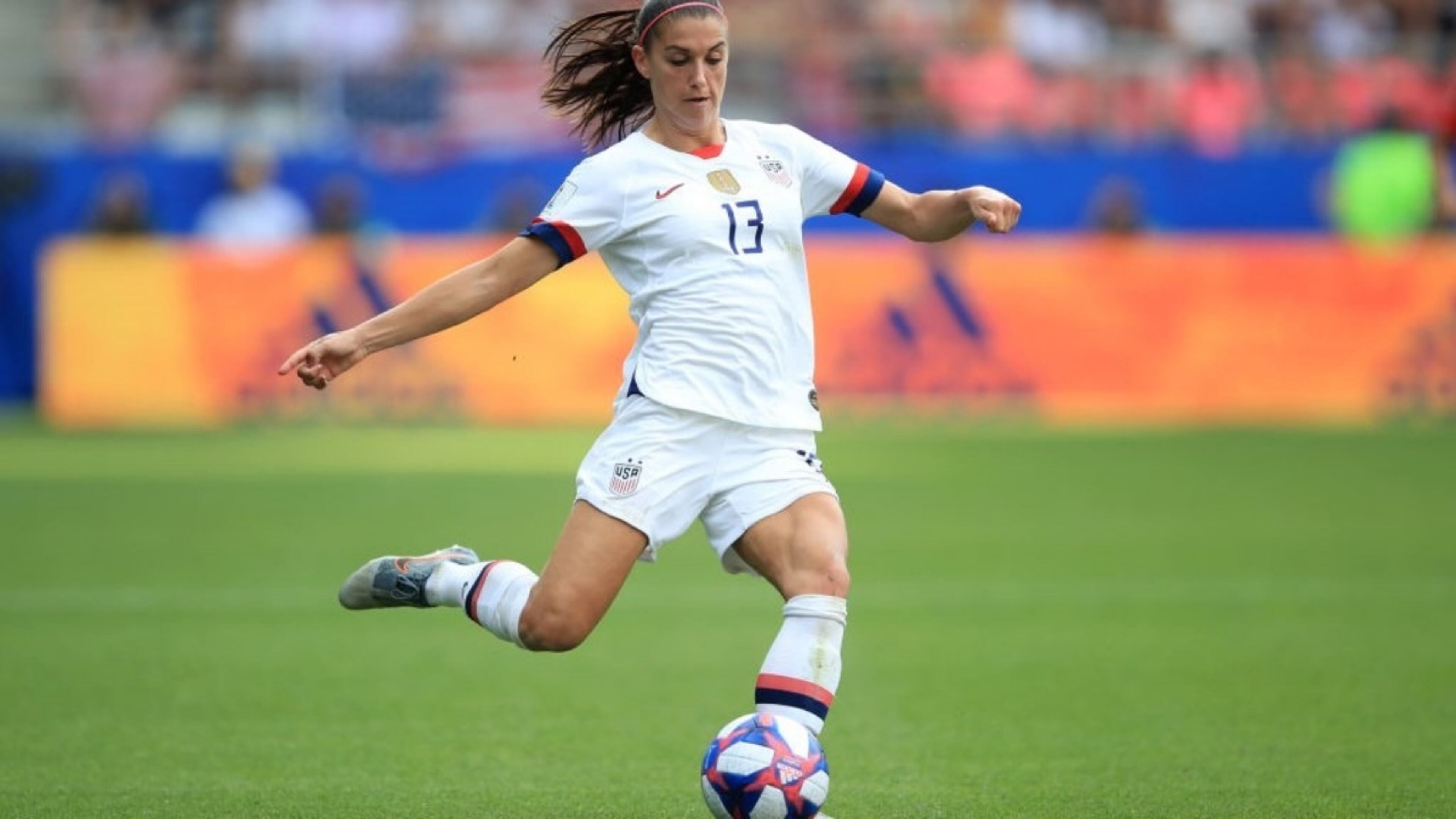 REIMS, FRANCE - Alex Morgan of USA advances the ball at the 2019 FIFA Women's World Cup France Round Of 16 match.