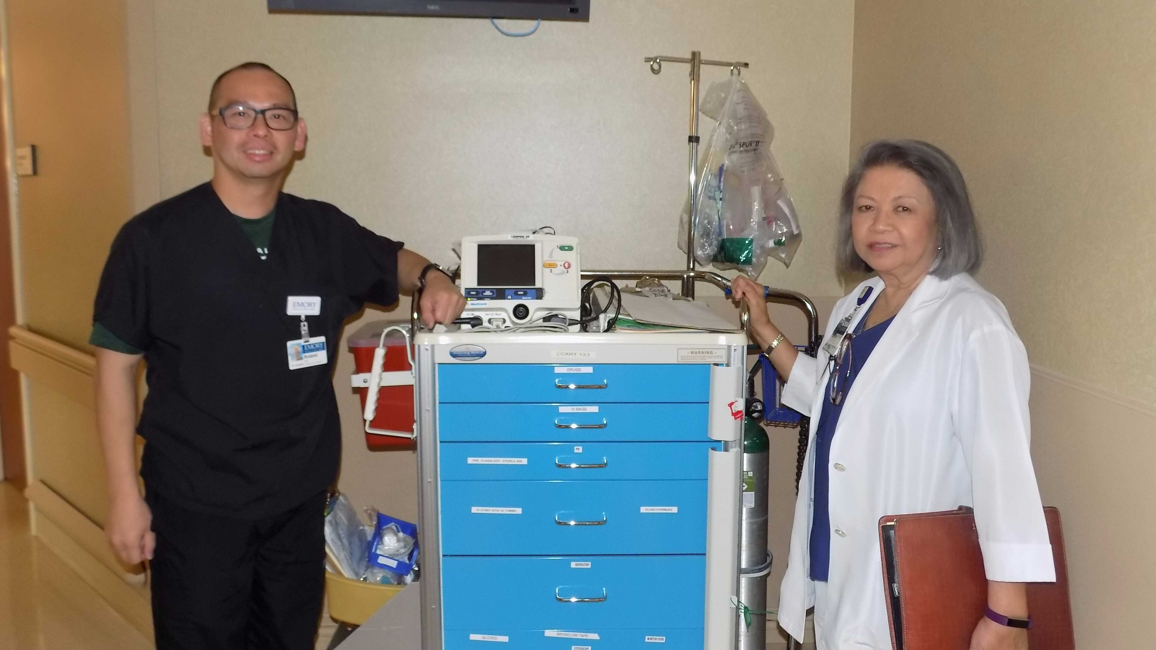Roland Tam, left, and Angelina Trinidad treated about 500 people, they say, inside a Texas high school gym that flipped into a “makeshift emergency room."
