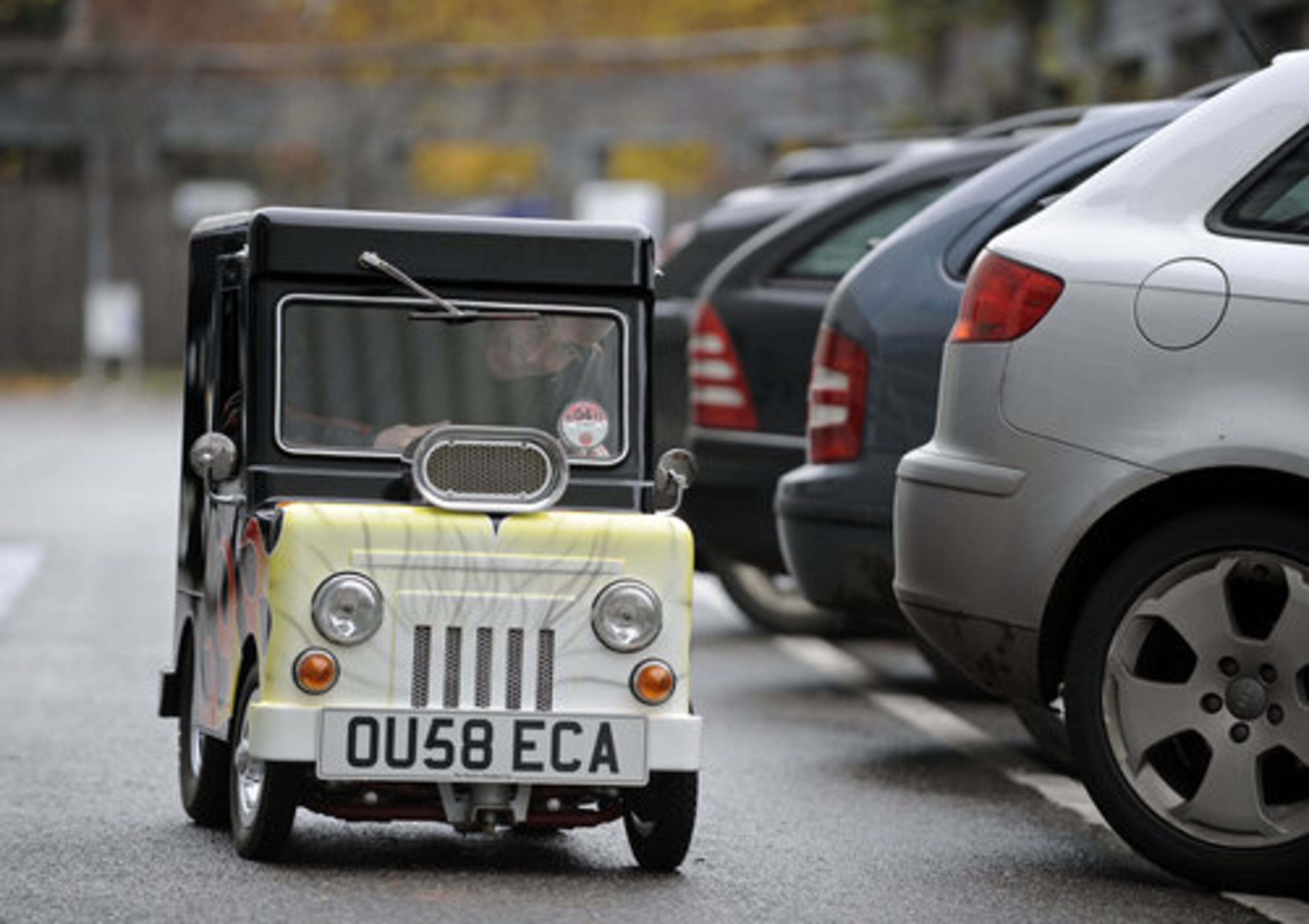 British constructor Perry Watkins drives in his "Wind Up" mini car on a street in Essen, Germany, Monday, Nov. 8, 2010.