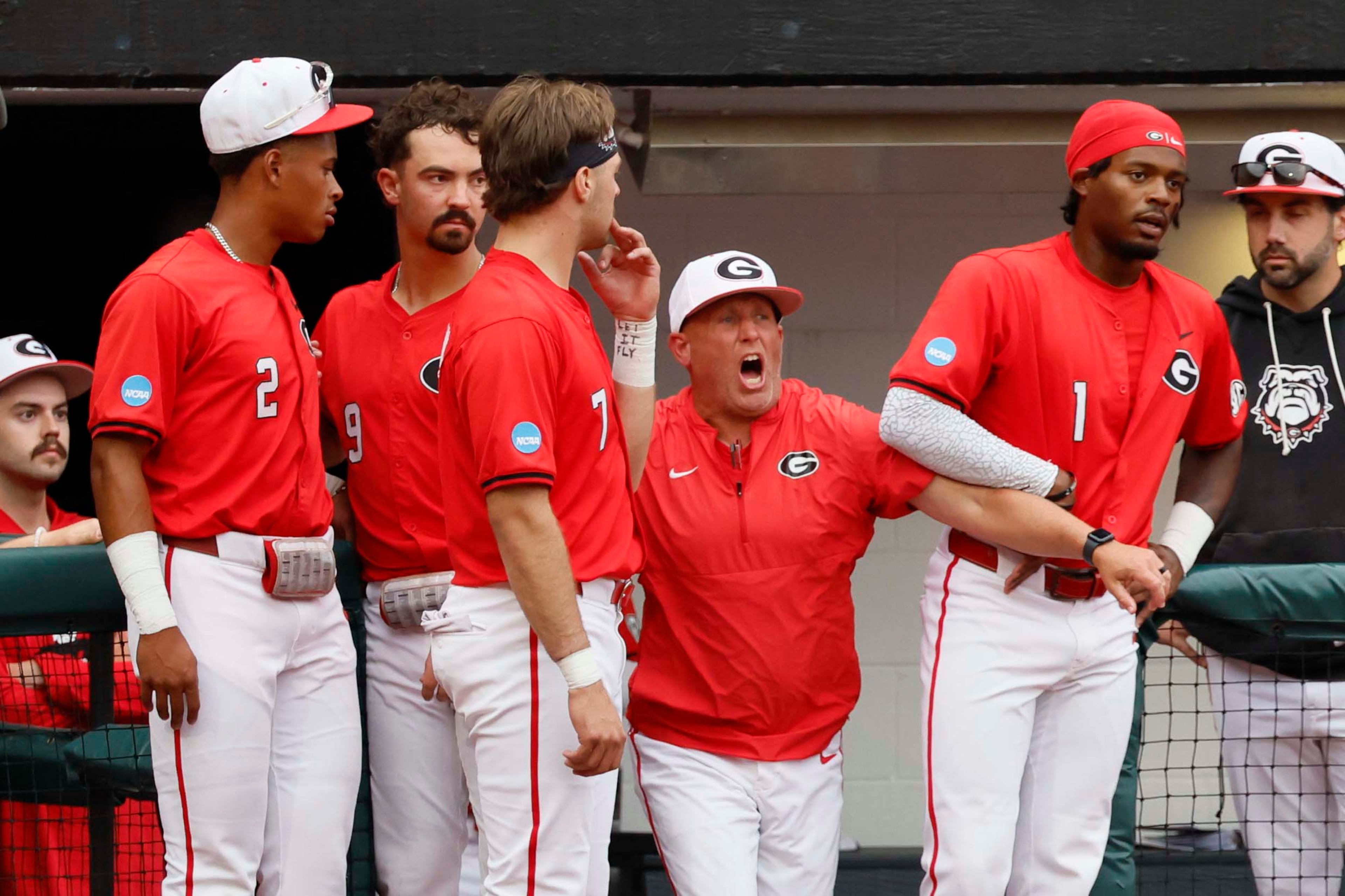 Georgia Bulldogs head coach Wes Johnson, center, reacts after his player, Georgia Bulldogs infielder Tre Phelps (1), was ejected for excessive celebration during the sixth inning of their NCAA Regional final game at Foley Field on Sunday, May 31, 2026, in Athens. Coach Johnson was also ejected.. (Miguel Martinez/AJC)