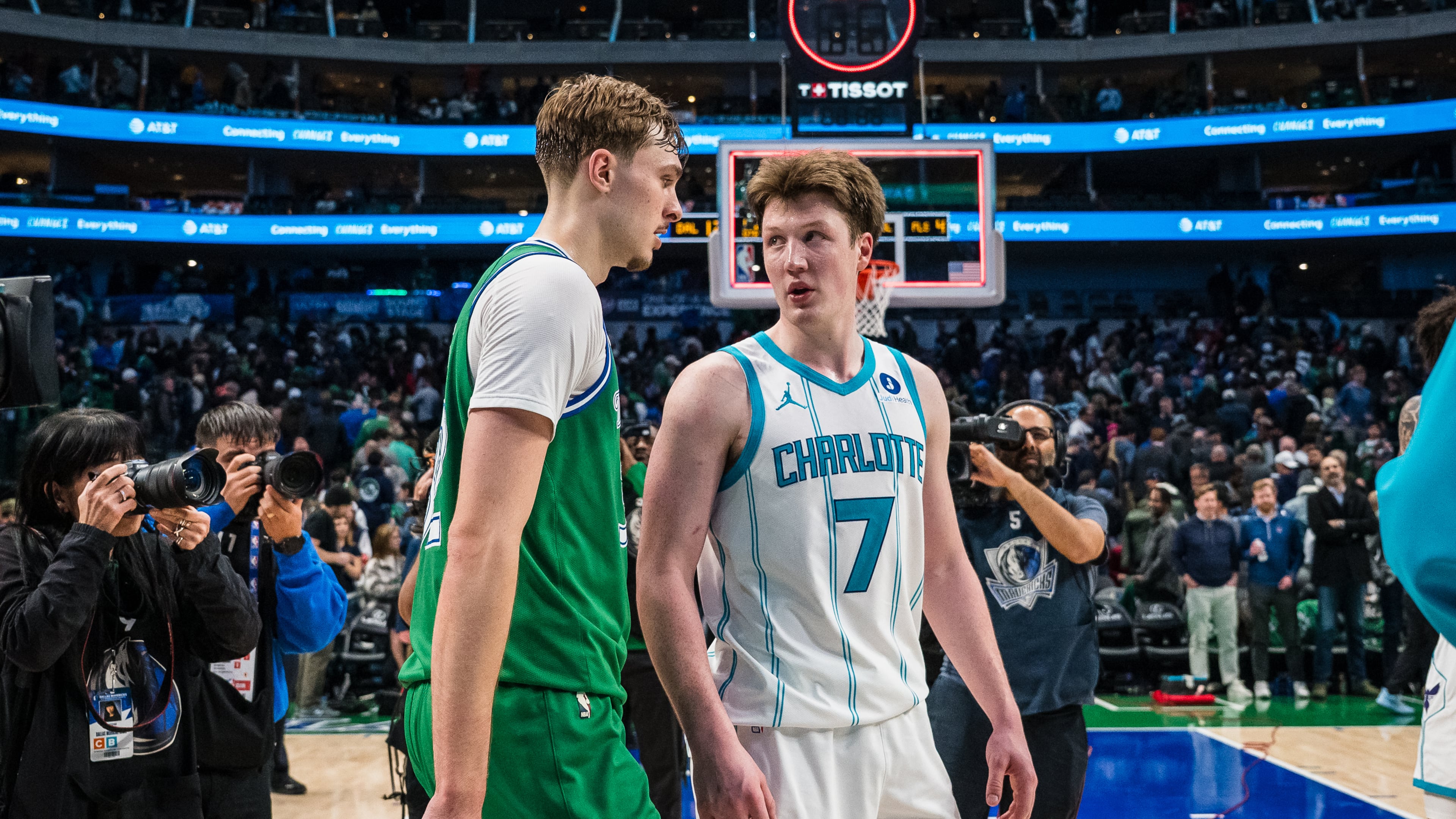 Dallas Mavericks forward Cooper Flagg, center left, and Charlotte Hornets guard Kon Knueppel (7) talk after an NBA basketball game, Thursday, Jan. 29, 2026, in Dallas. (AP Photo/Jessica Tobias)