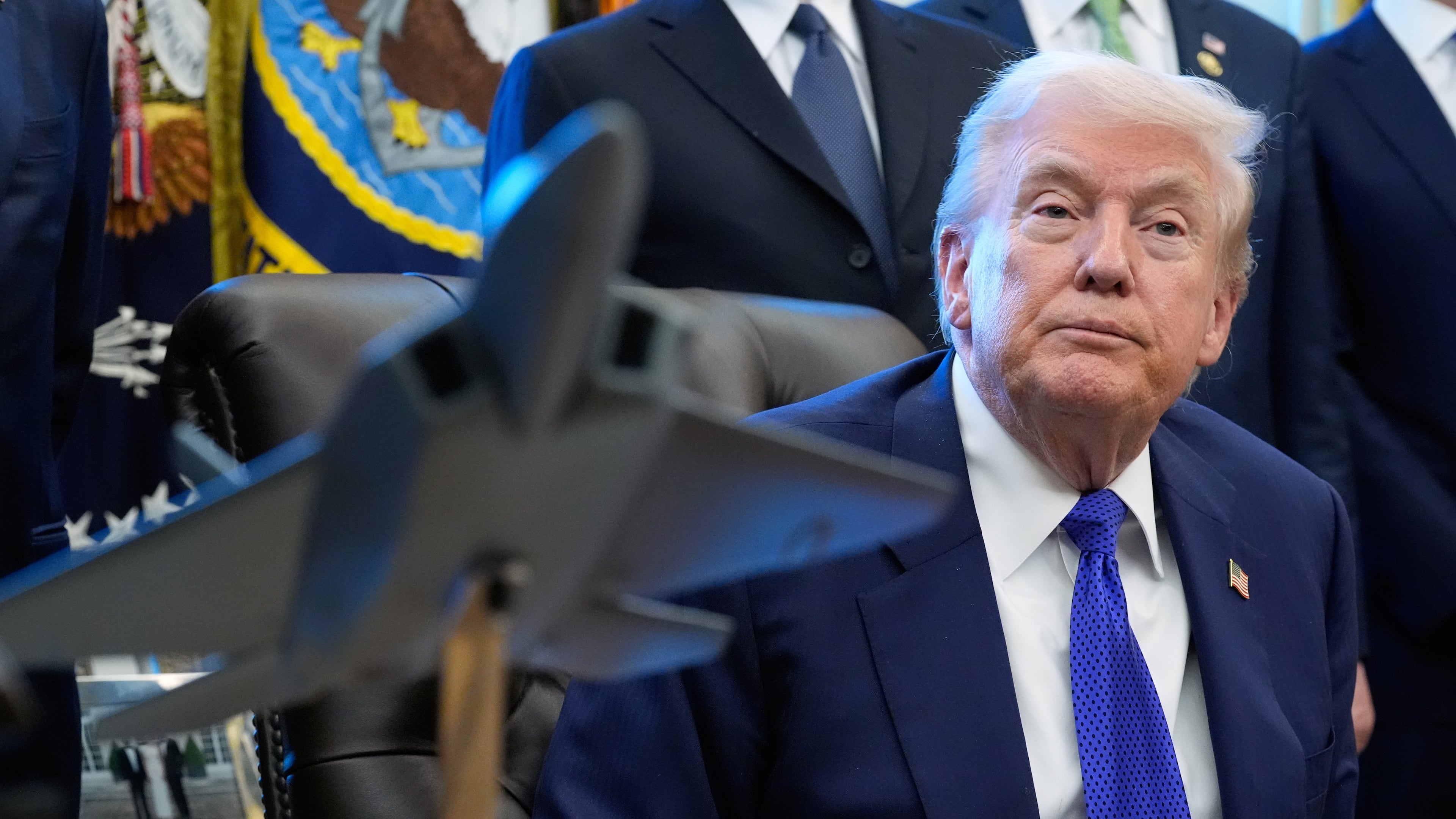 President Donald Trump listens to a question from a reporter as he speaks in the Oval Office of the White House, Monday, Feb. 2, 2026, in Washington. (AP Photo/Alex Brandon)