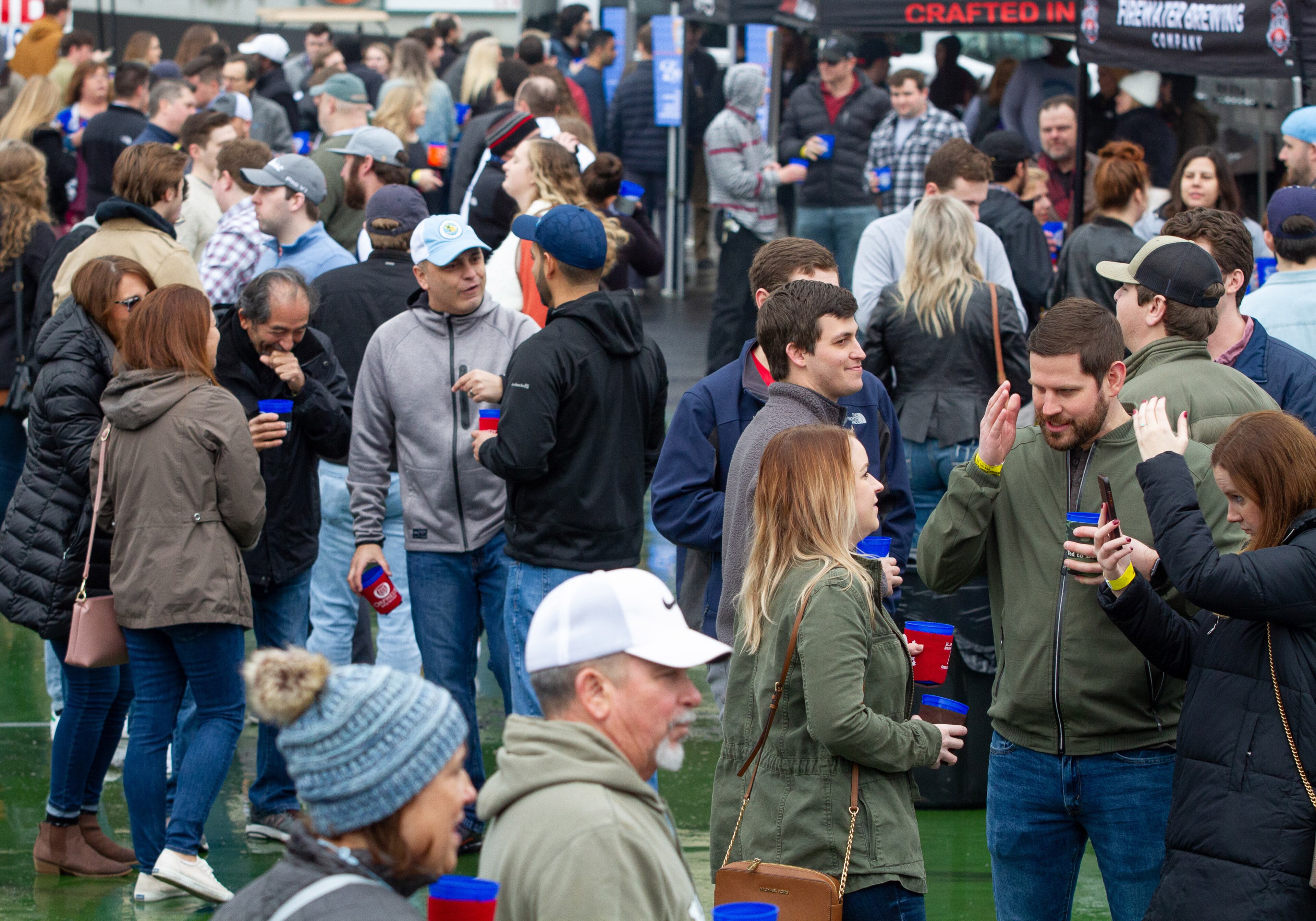 People listen to music and drink beer during the Atlanta Winter Beer Festival at Atlantic Station on Saturday, February 1, 2020. STEVE SCHAEFER / SPECIAL TO THE AJC