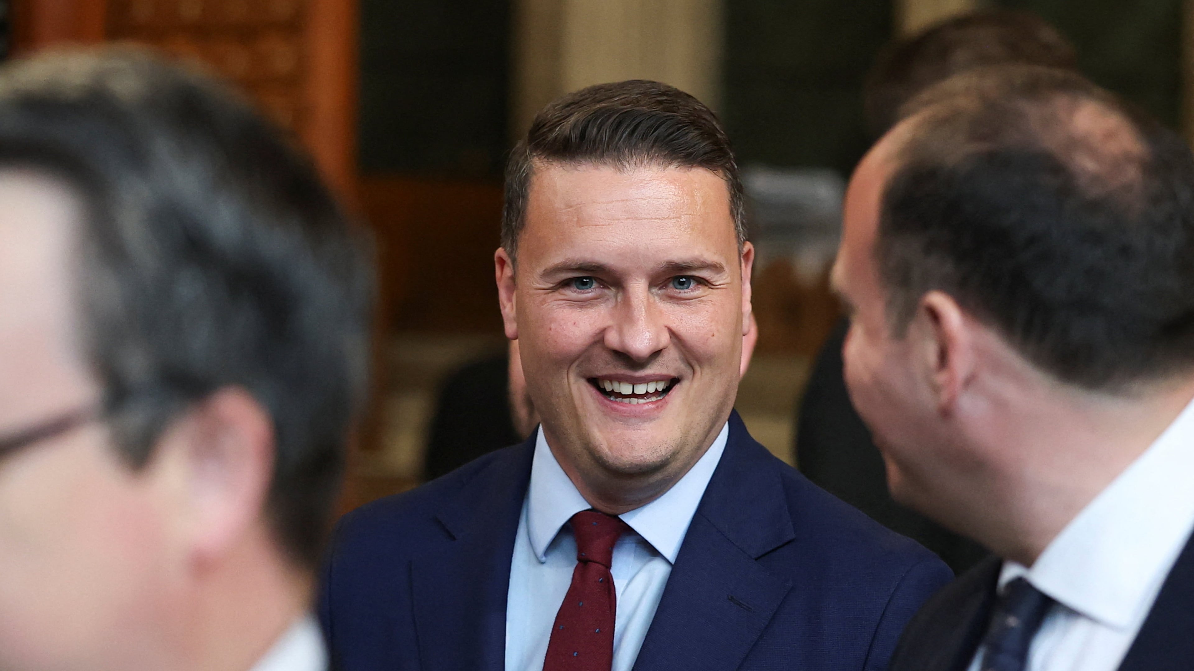 British Health Secretary Wes Streeting walks through the House of Commons to attend the State Opening of Parliament at the Palace of Westminster, London, Wednesday, May 13, 2026. (Toby Melville/Pool Photo via AP)