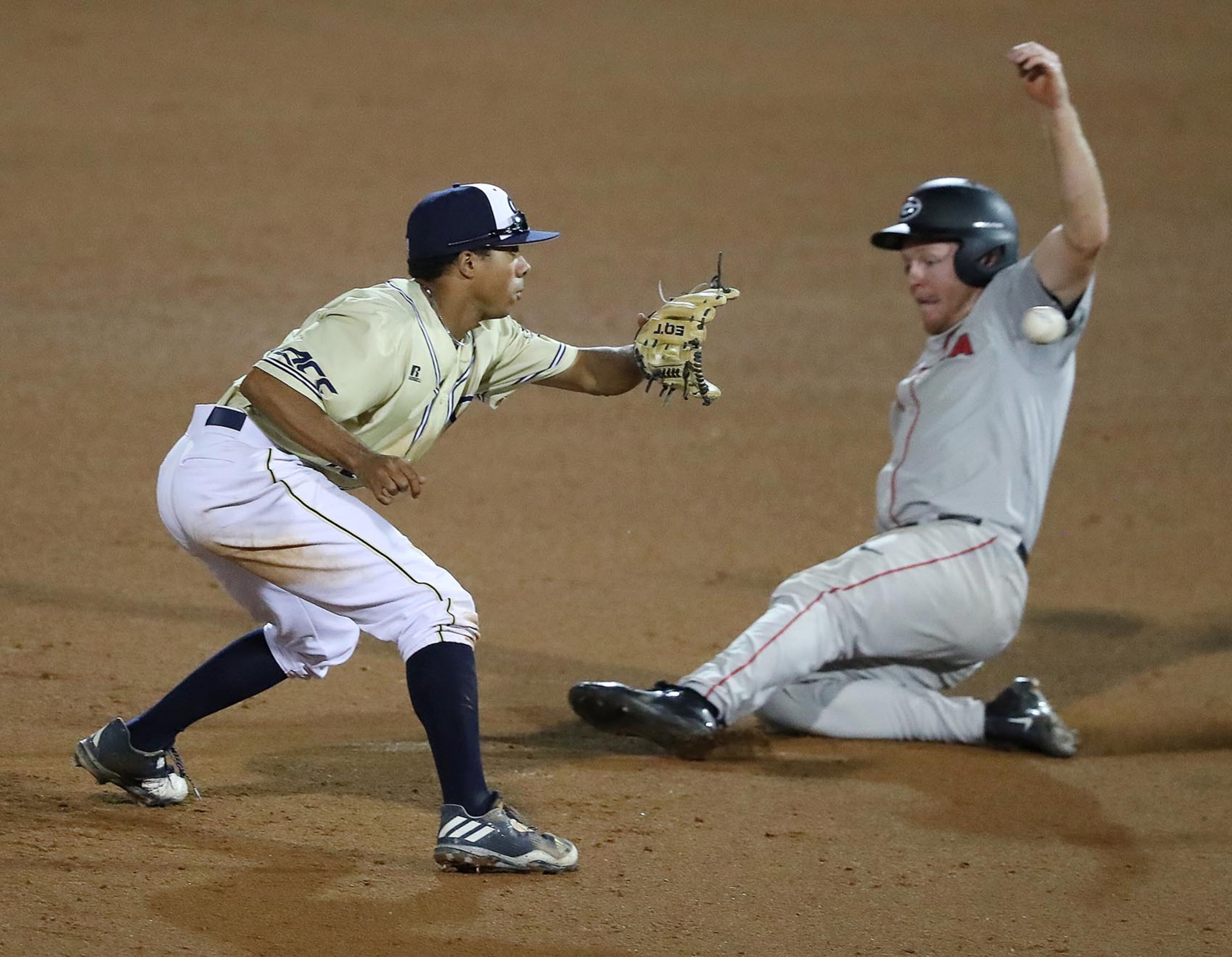 April 25, 2017, Atlanta: Georgia Tech infielder Austin Wilhite takes the throw catching Georgiaââ¬â¢s Mitchell Webb stealing second for the out during the sixth inning in a NCAA college baseball game on Tuesday, April 25, 2017, at Russ Chandler Stadium in Atlanta. Curtis Compton/ccompton@ajc.com