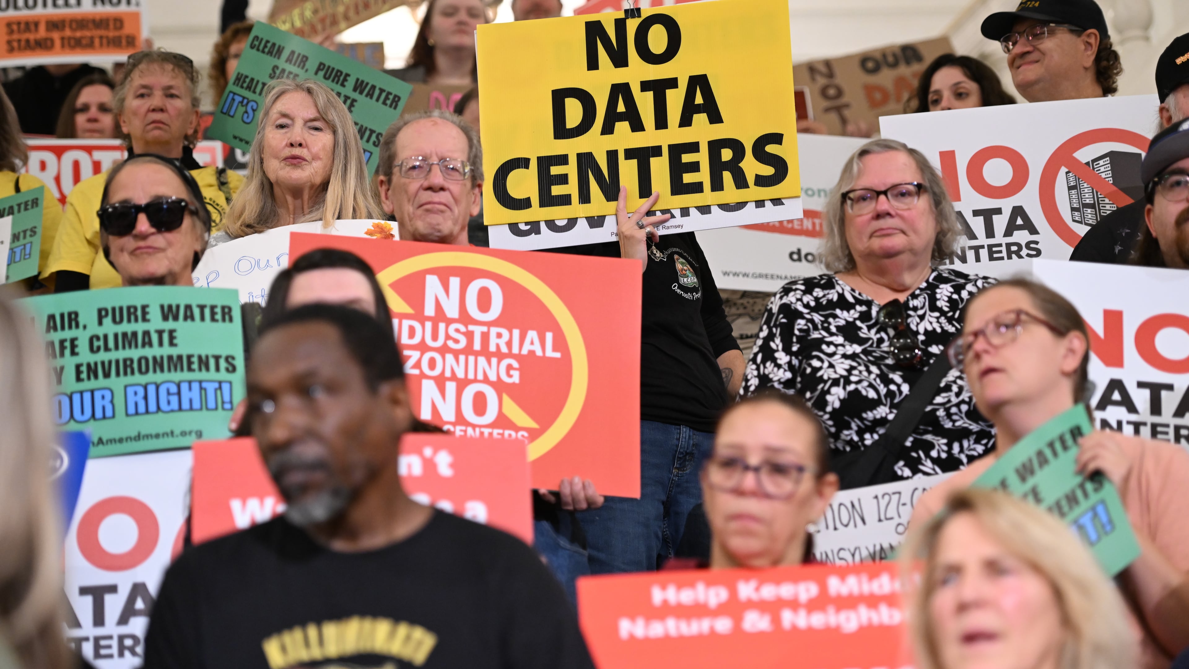 FILE - Anti-data center demonstrators protest at the Pennsylvania state Capitol, Oct. 6, 2026, in Harrisburg, Pa. (AP Photo/Marc Levy, File)