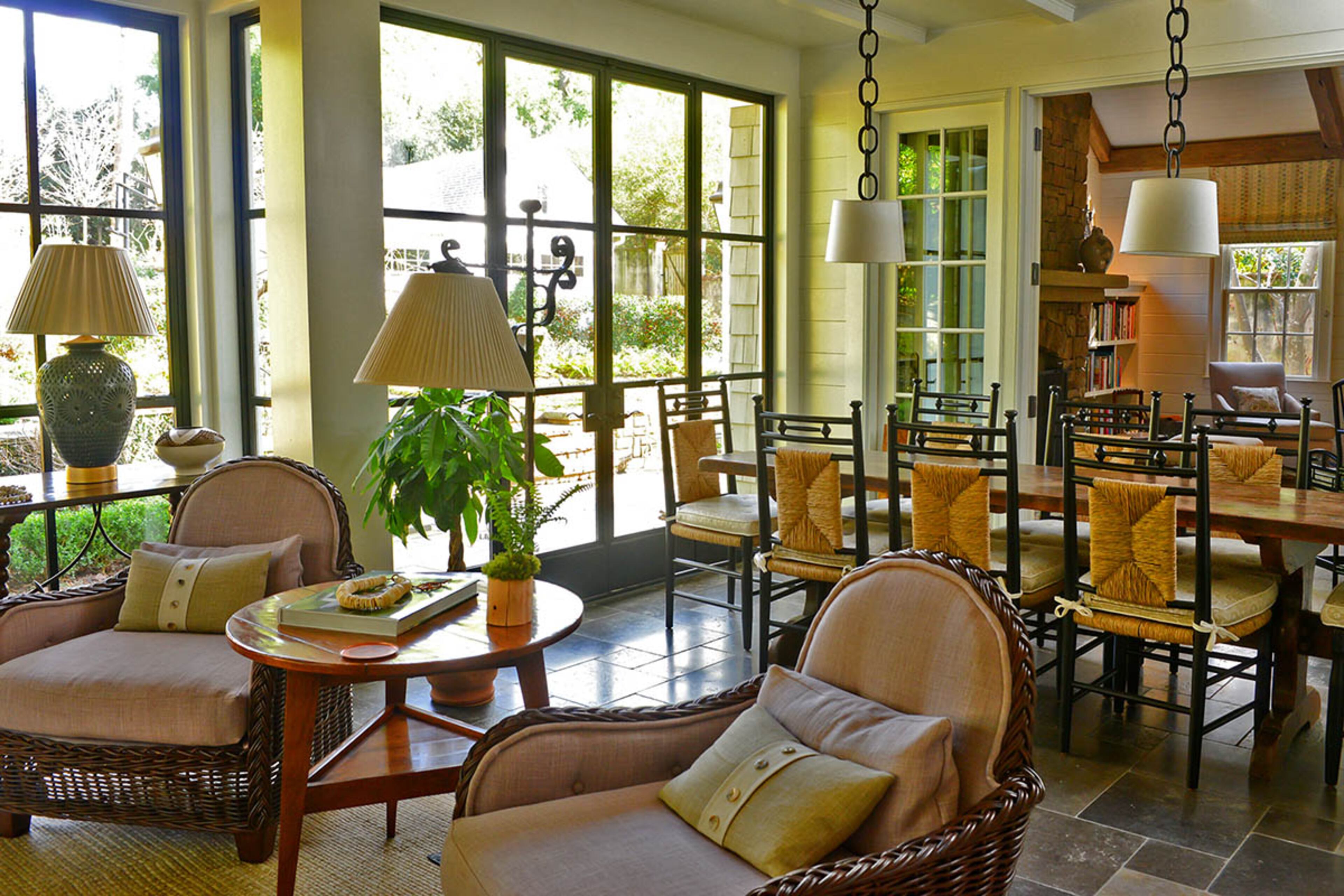 A narrow oak farmhouse table, which homeowner Evie Johnson found at Provenance Antiques, makes it easy for the family to come together and talk at mealtimes in what she calls "a lofty space" in her Buckhead home.