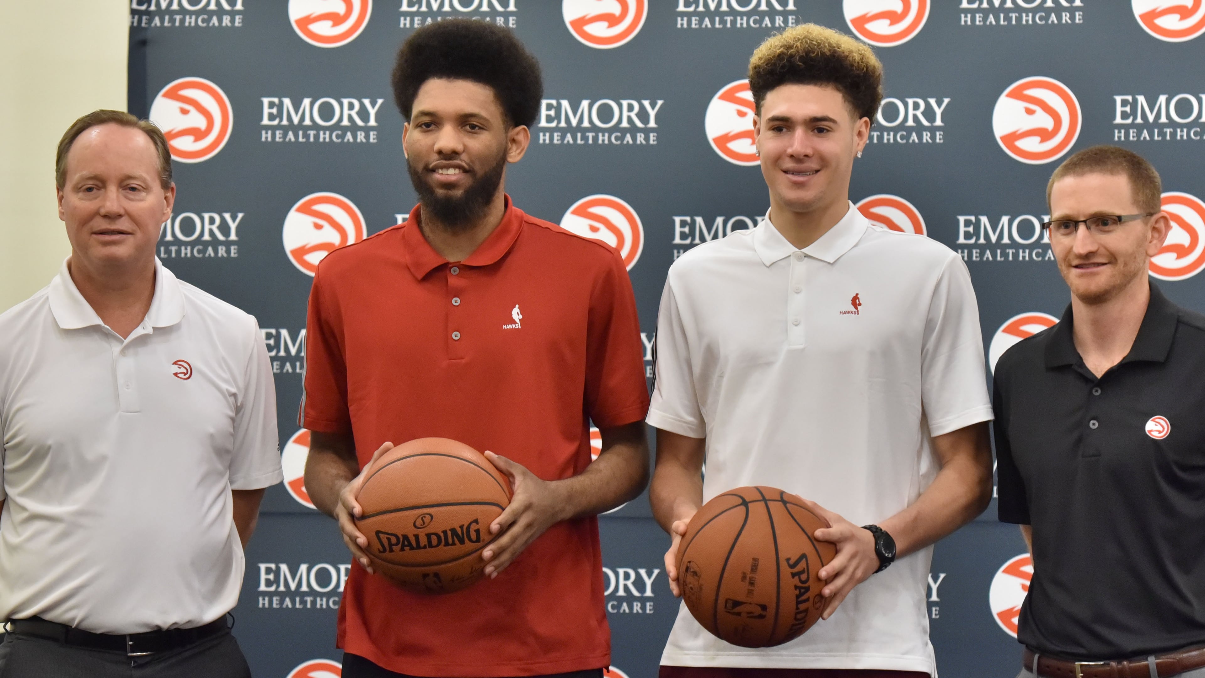 DeAndre’ Bembry (center left) and Isaia Cordinier (center right) pose with head coach Mike Budenholzer (left) and then assistant general manager Wes Wilcox during a press conference on Tuesday, June 28, 2016. The Hawks selected St. Joseph’s University forward DeAndre’ Bembry with the 21th overall pick in the first round and Isaia Cordinier in the second round (44th overall) of the 2016 NBA Draft. HYOSUB SHIN / HSHIN@AJC.COM