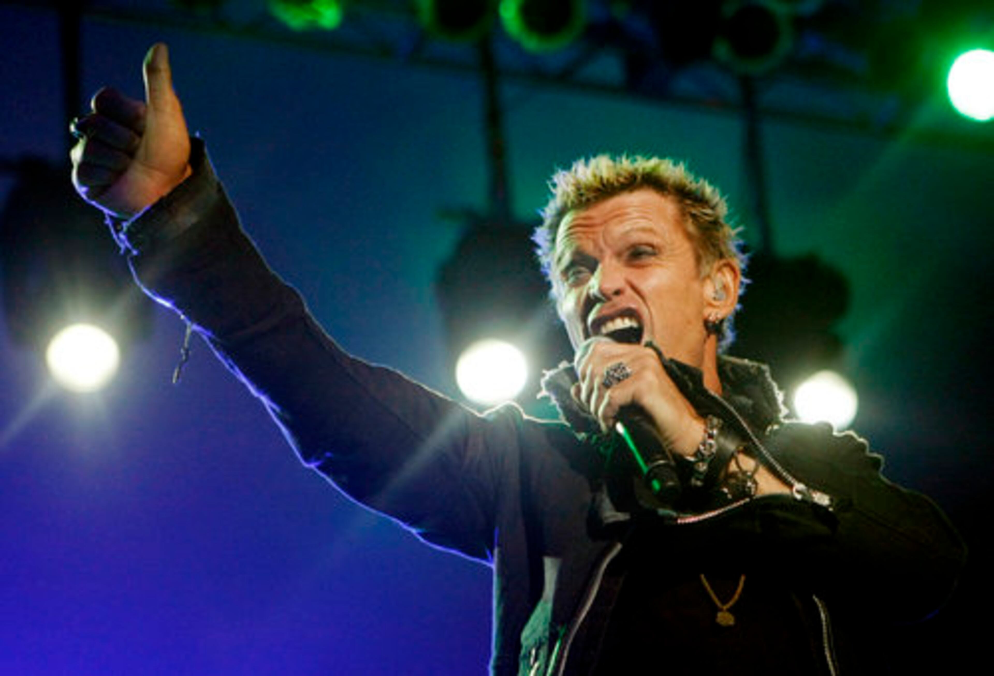 English rock musician Billy Idol plays to the crowd as he performs at Chastain Park Amphitheatre in Atlanta on Sunday, August 29, 2010.