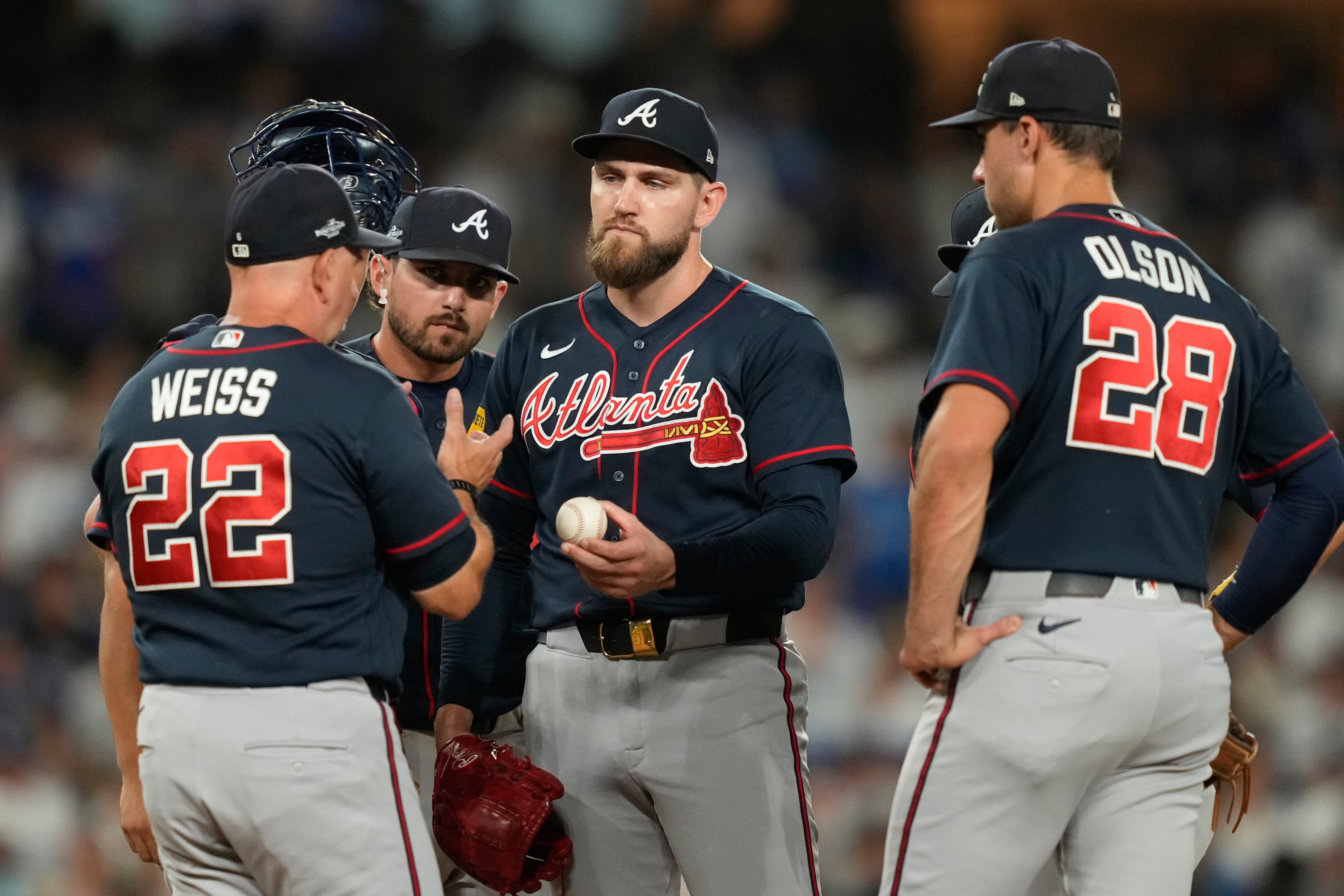 Atlanta Braves manager Walt Weiss (22) gets the ball from pitcher Dylan Lee as Lee exits during the fifth inning of Game 2 of a National League Division Series baseball game against the Los Angeles Dodgers Sunday, Oct. 4, 2026, in Los Angeles. (AP Photo/Mark J. Terrill)