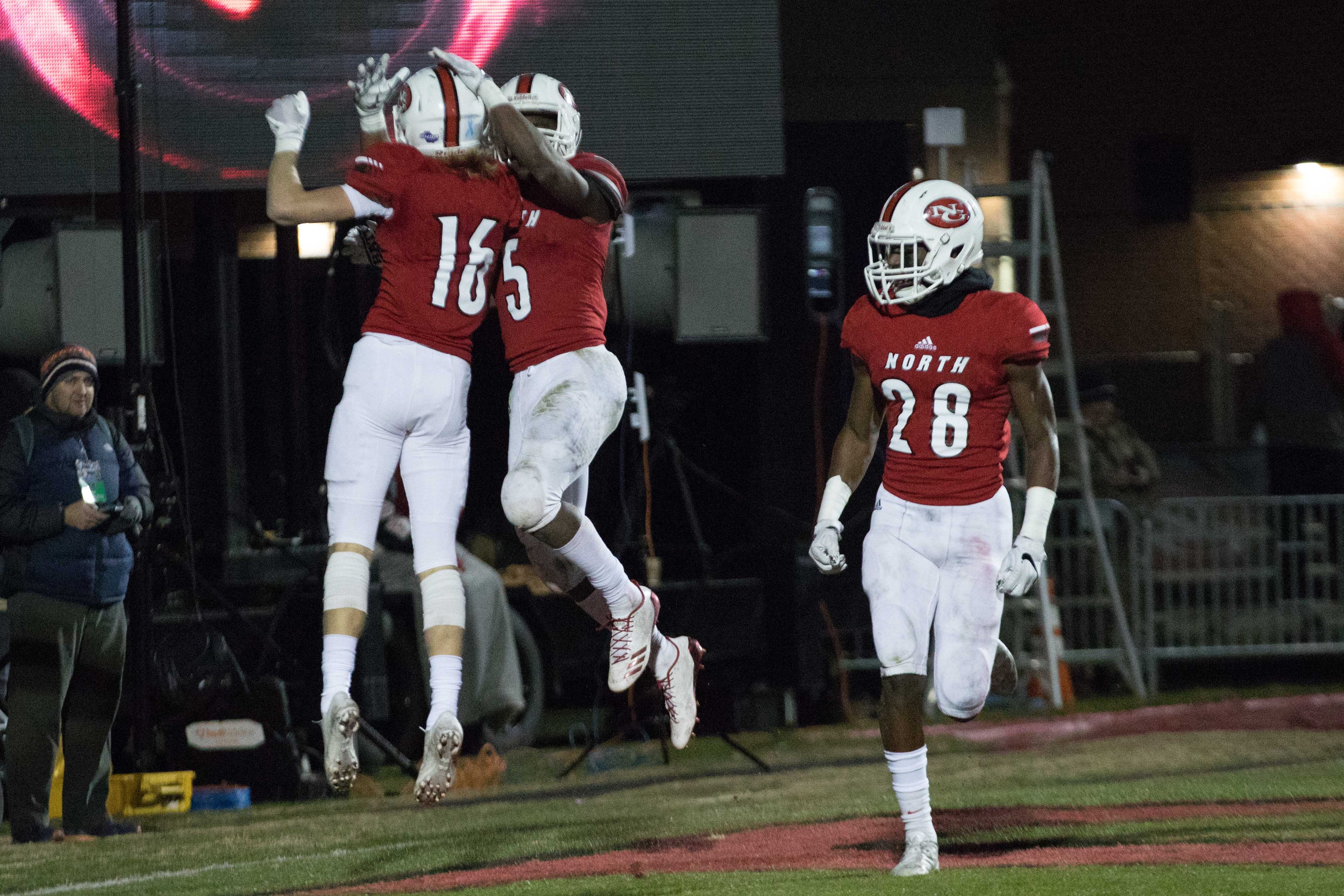North Gwinnett's Tyler Goodson (5) celebrates with teammates after scoring a touchdown against Colquitt High School during a Class AAAAAAA football championship game, Friday, Dec. 15, 2017, in Suwanee, Ga.