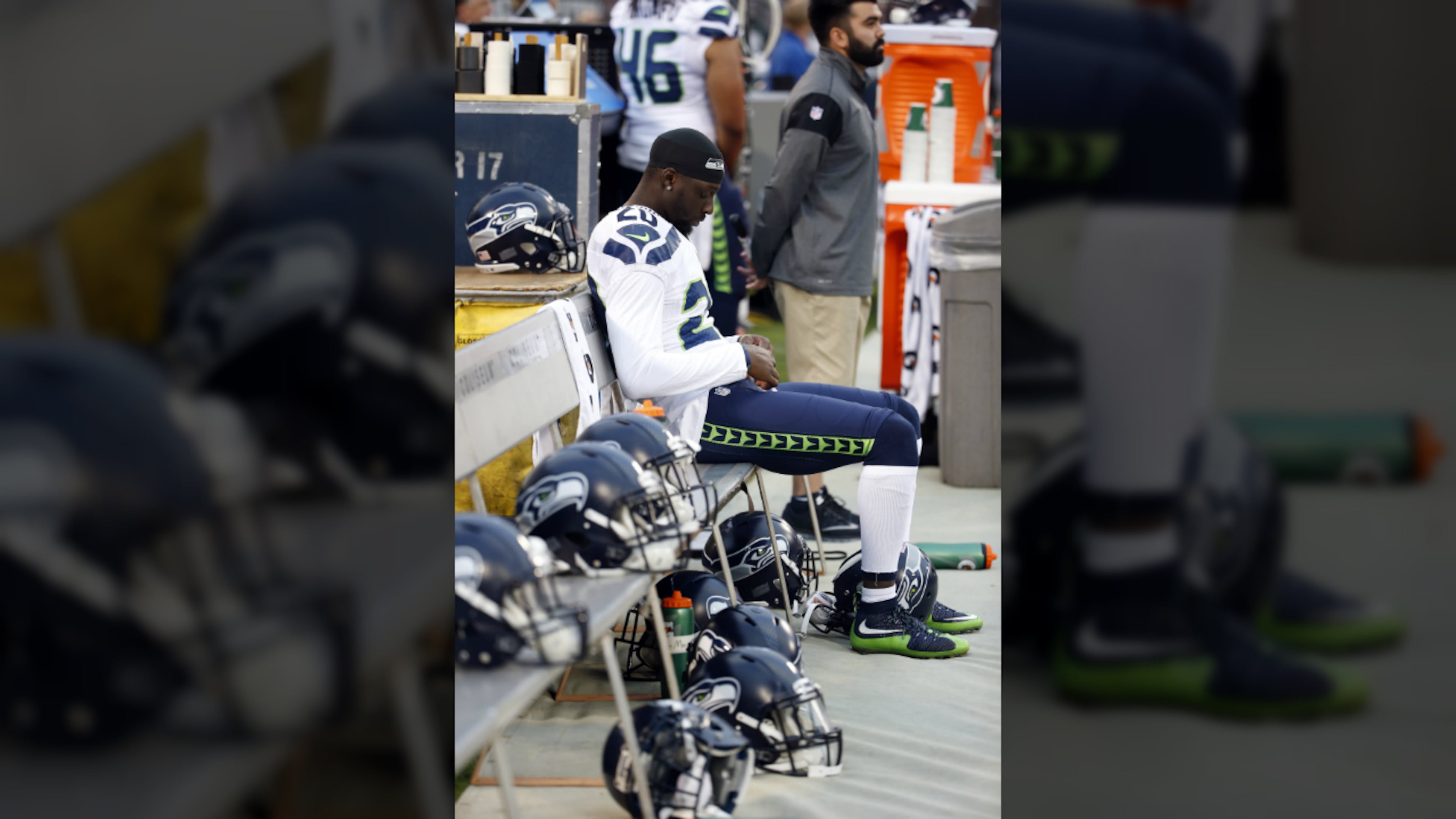 Seattle Seahawks cornerback Jeremy Lane sits as the national anthem plays before a preseason NFL football game against the Oakland Raiders Thursday, Sept. 1, 2016, in Oakland, Calif. (AP Photo/Tony Avelar)