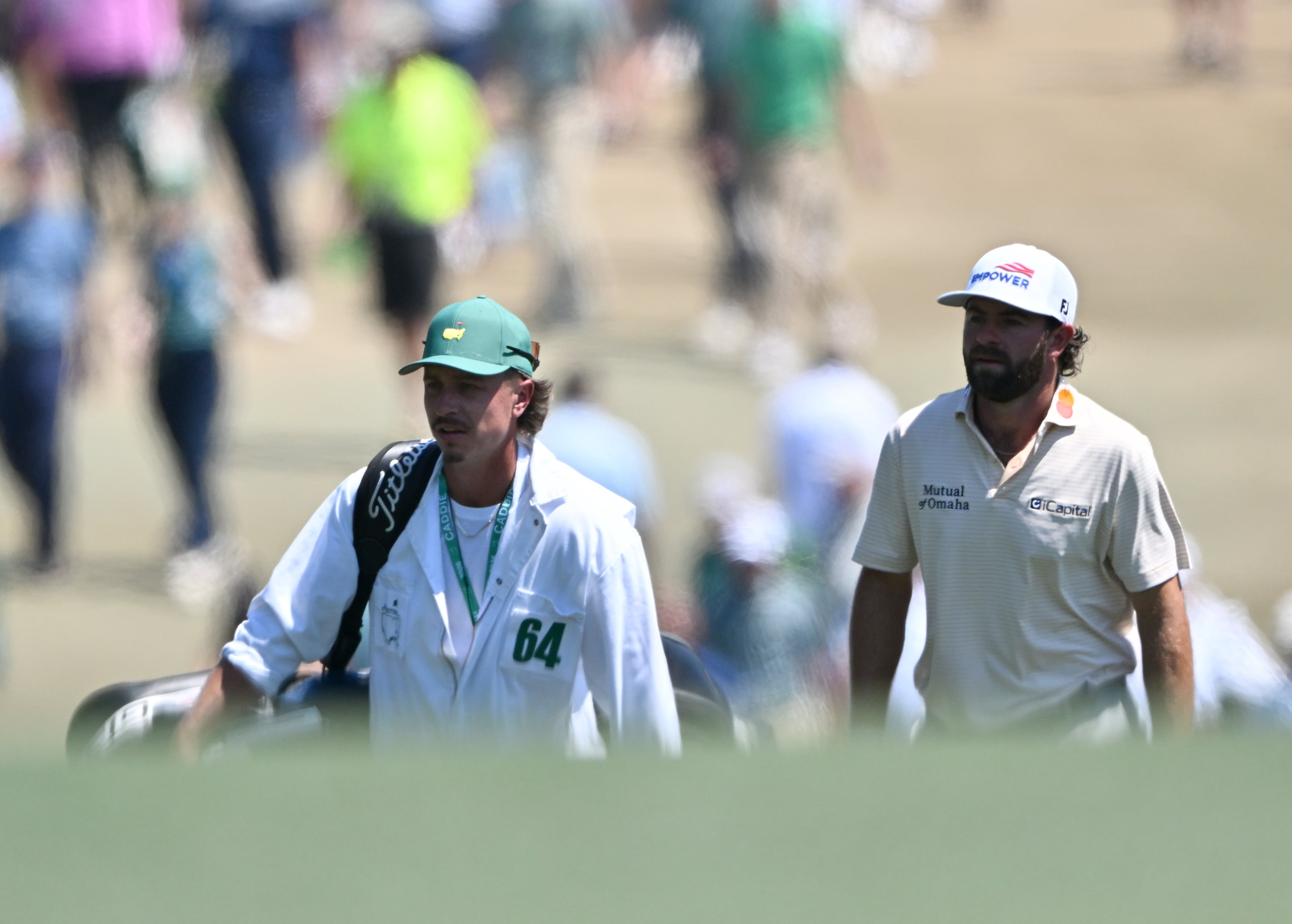 Cameron Young and caddie Kyle Sterbinsky walk down first fairway during final round of the Masters, at Augusta National Golf Club, Sunday, April 12, 2026, in Augusta, GA (Hyosub Shin/AJC)