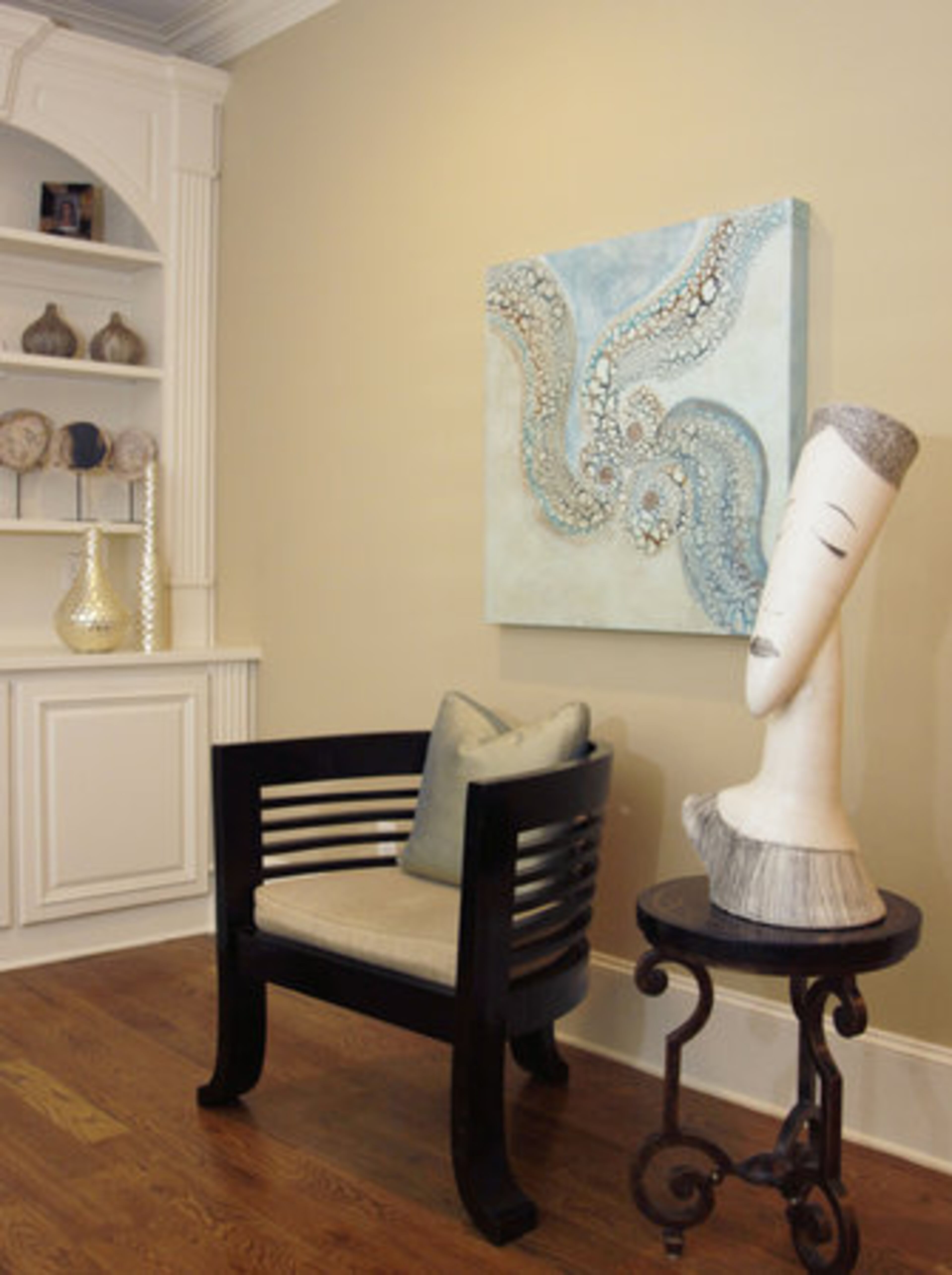 "I collect art, sculptures and figures," shares Kline. Pictured is an area in the family den.
