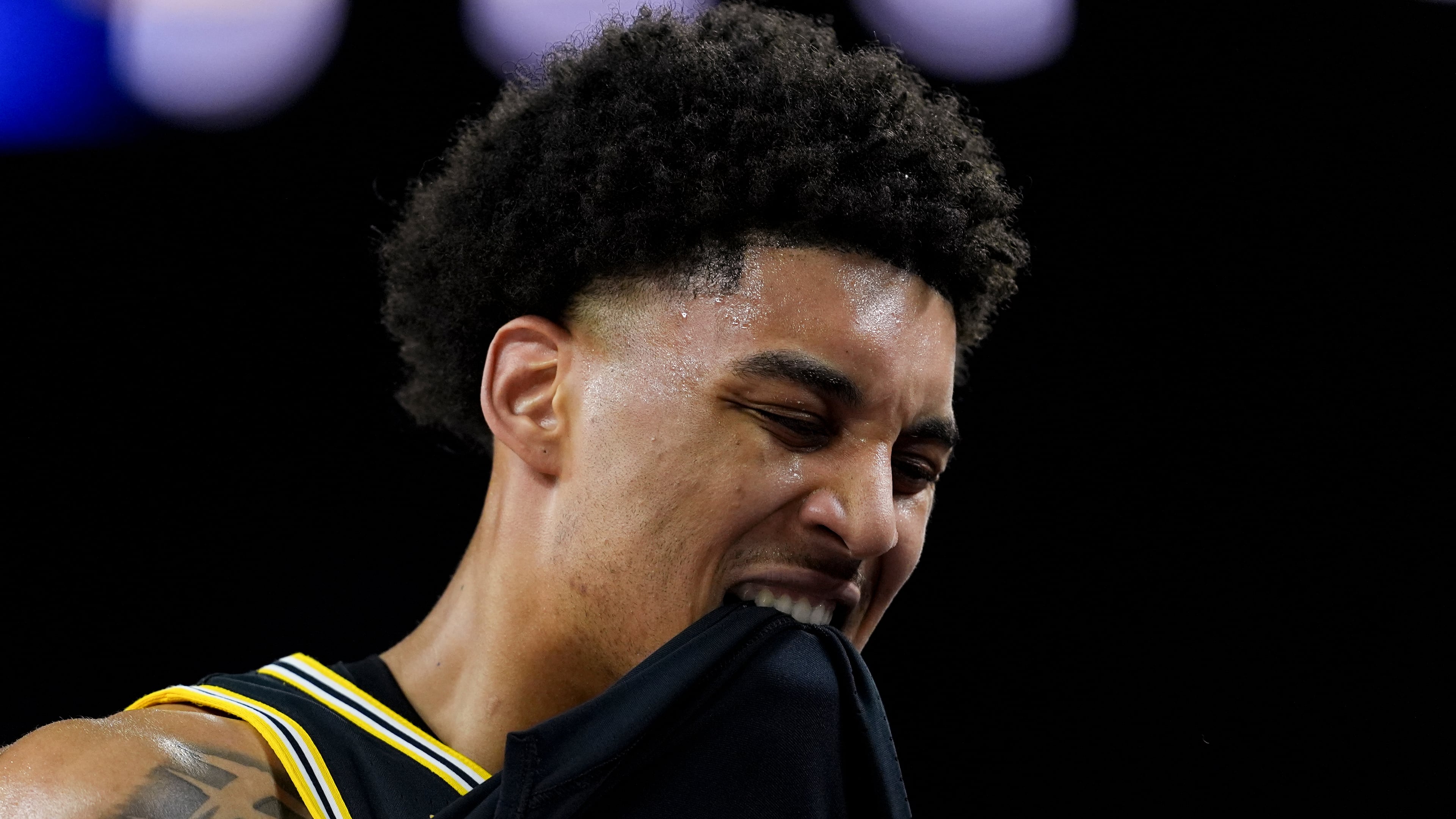 Michigan forward Yaxel Lendeborg reacts after an injury on the court during the first half of an NCAA college basketball tournament semifinal game against Arizona at the Final Four, Saturday, April 4, 2026, in Indianapolis. (AP Photo/Abbie Parr)