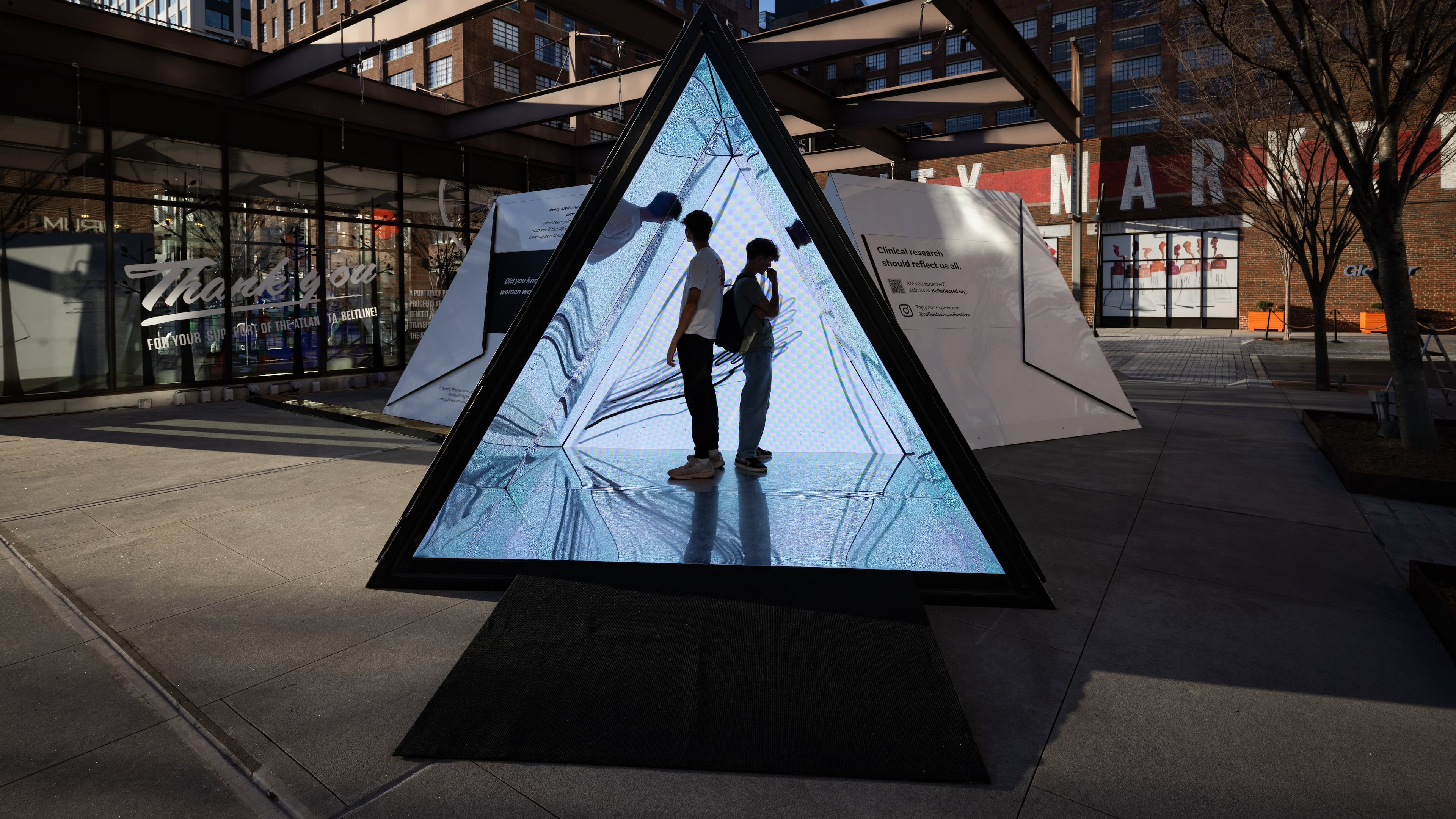Visitors venture inside a kaleidoscope by Atlanta artist William Downs. The artwork is part of a pop-up exhibit at Ponce City Market by Dash Studio that focuses on themes of health, wellness and medicine. (Courtesy of Dash Studio)