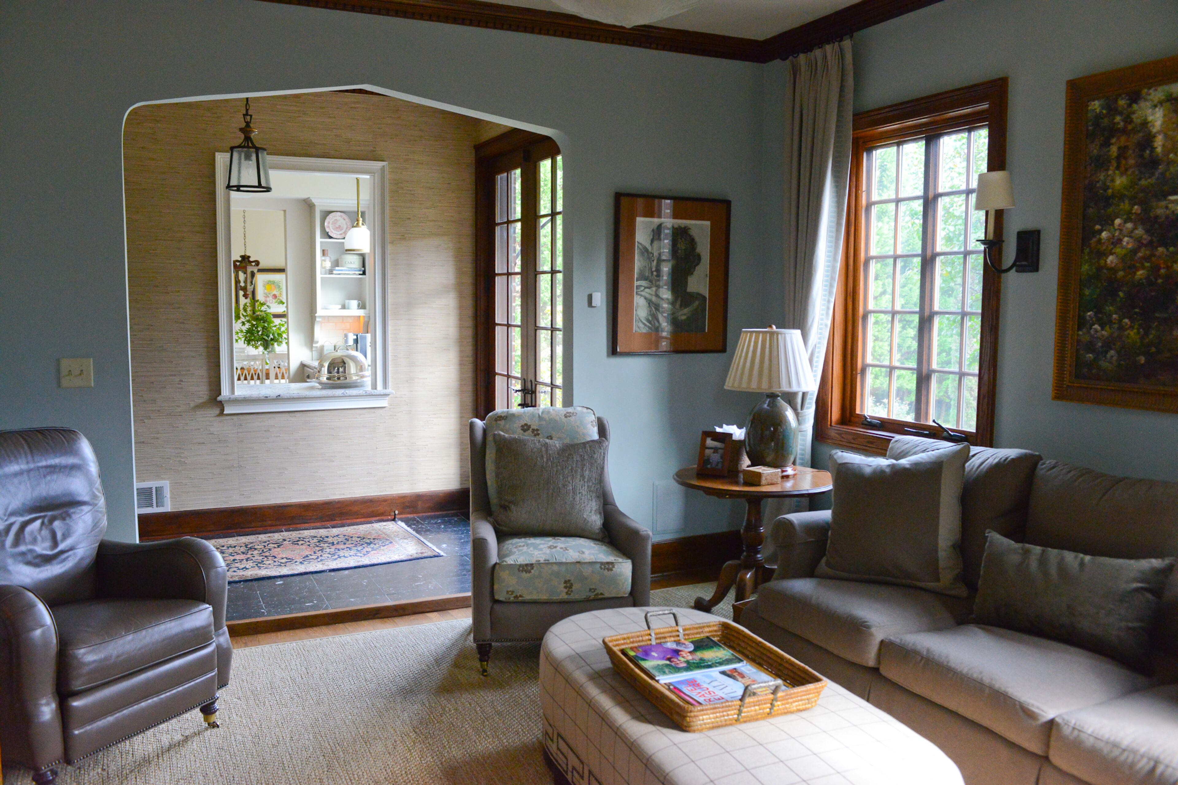 In the den, restored archways and oak molding preserve the 110-year-old home's original charm and allow the classic traditional interior style to shine. The homeowners worked with interior designer Donna Campbell of Donna Campbell Home.