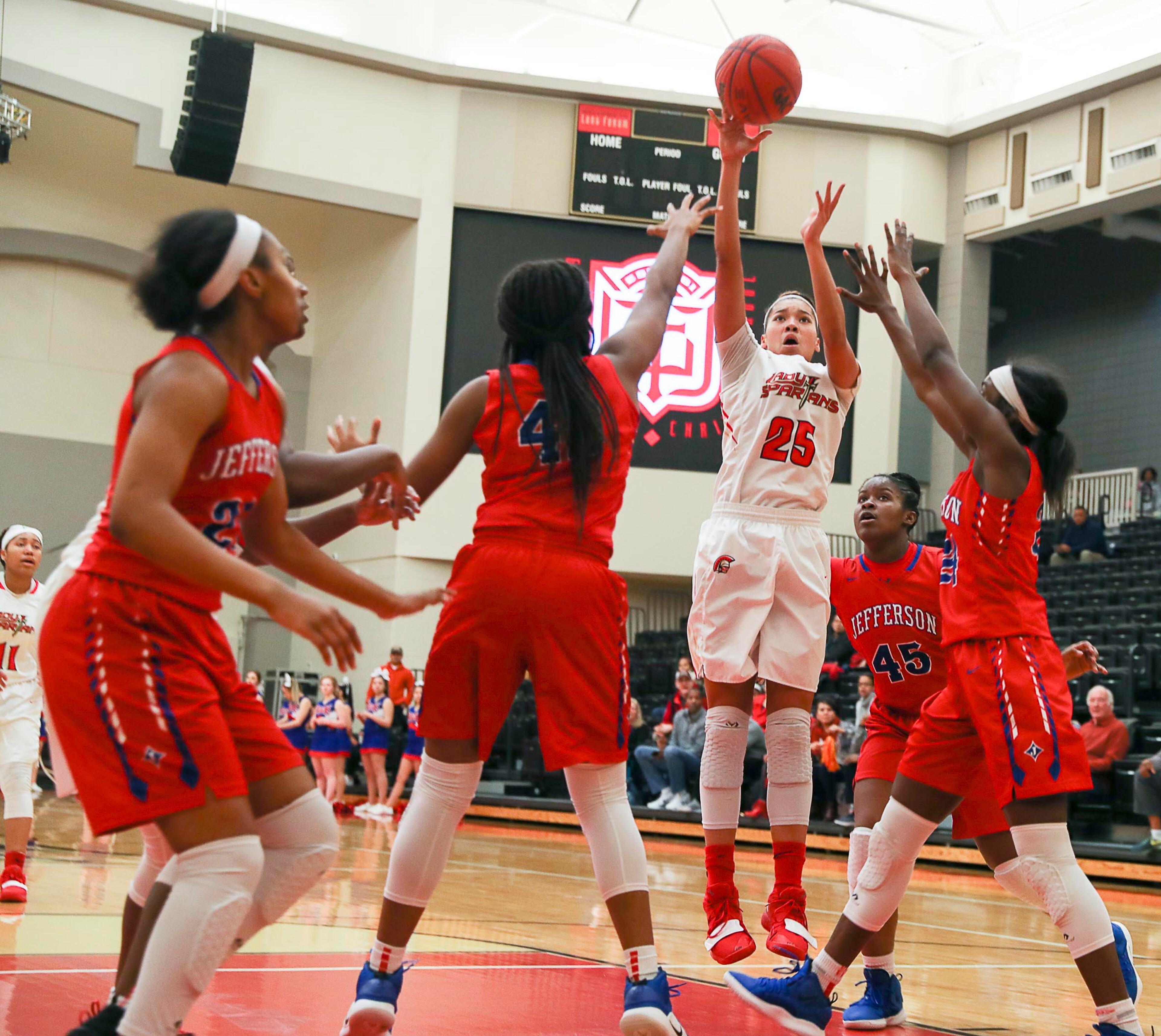 GAC's Maya Timberlake shoots against a host of Jefferson defenders. (Alyssa Pointer/Alyssa.Pointer@ajc.com)