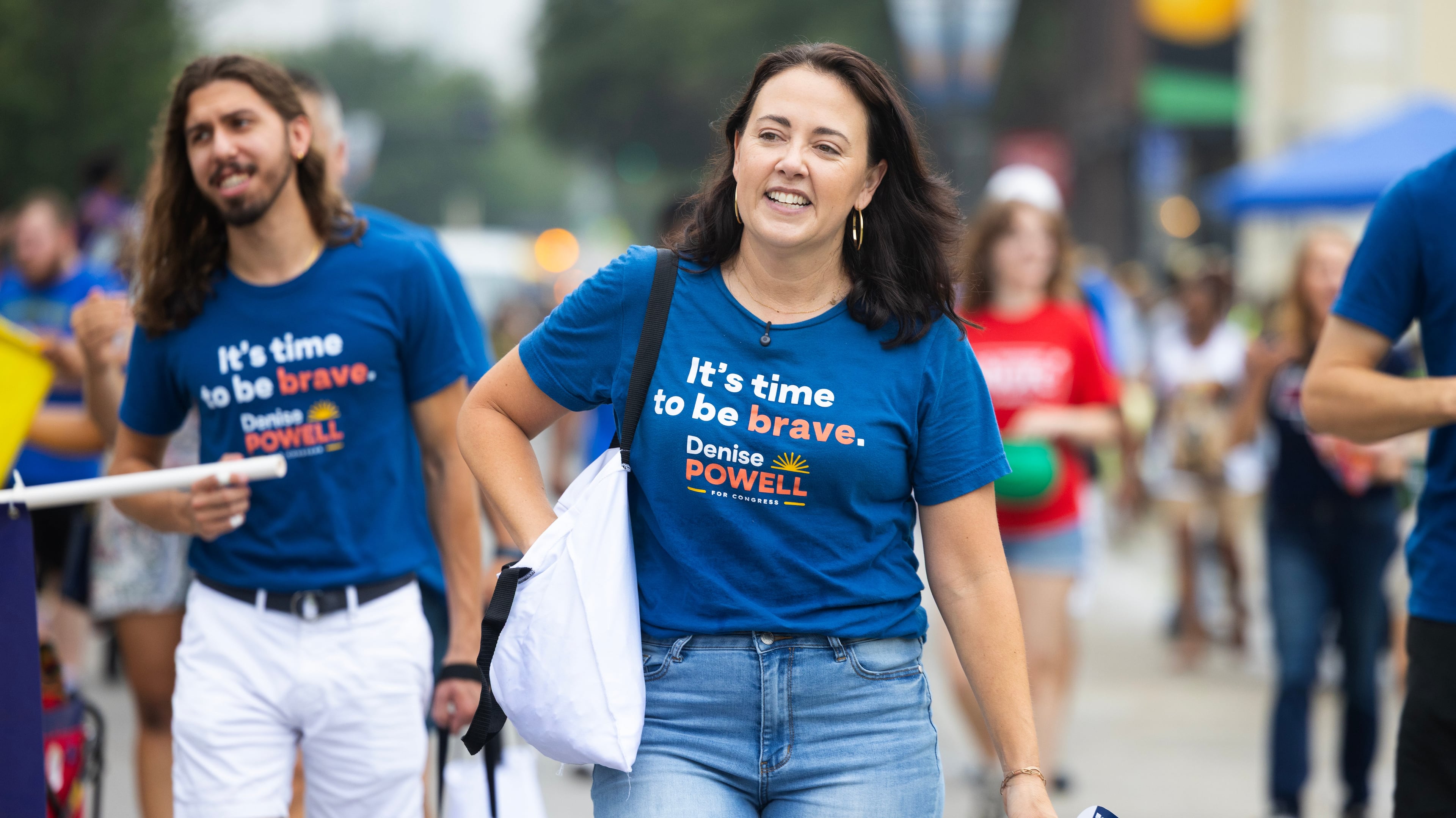 Denise Powell, the Democratic candidate for the House of Representatives in Nebraska's second congressional district, walks with the Nebraska Democratic Party in a Juneteenth Parade in Omaha, Neb., Saturday, Aug. 15, 2026. (AP Photo/Rebecca S. Gratz)