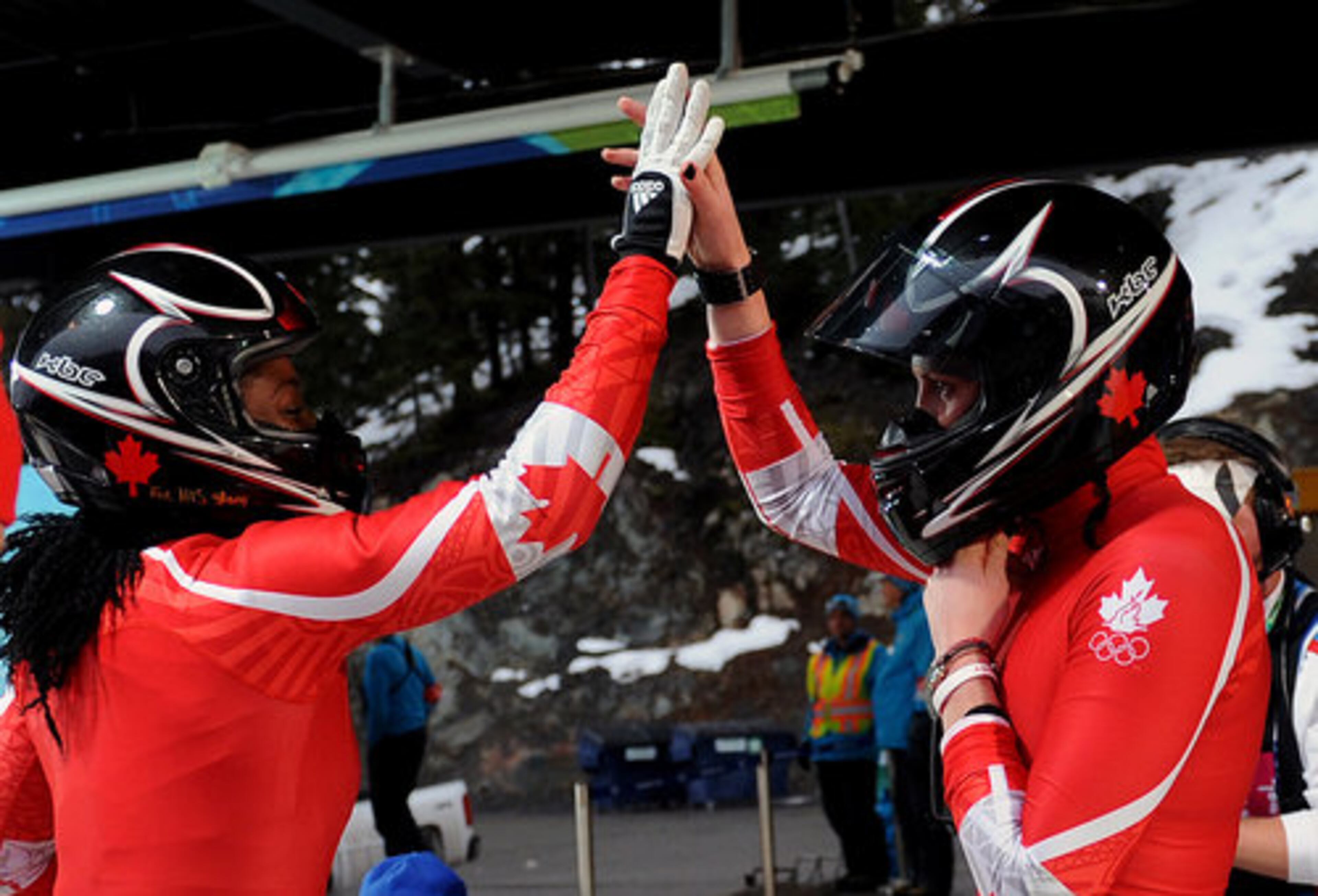 Canada's Shelley-Ann Brown (left) and Helen Upperton celebrate after their first run in the women's Two-Man Bobsleigh.