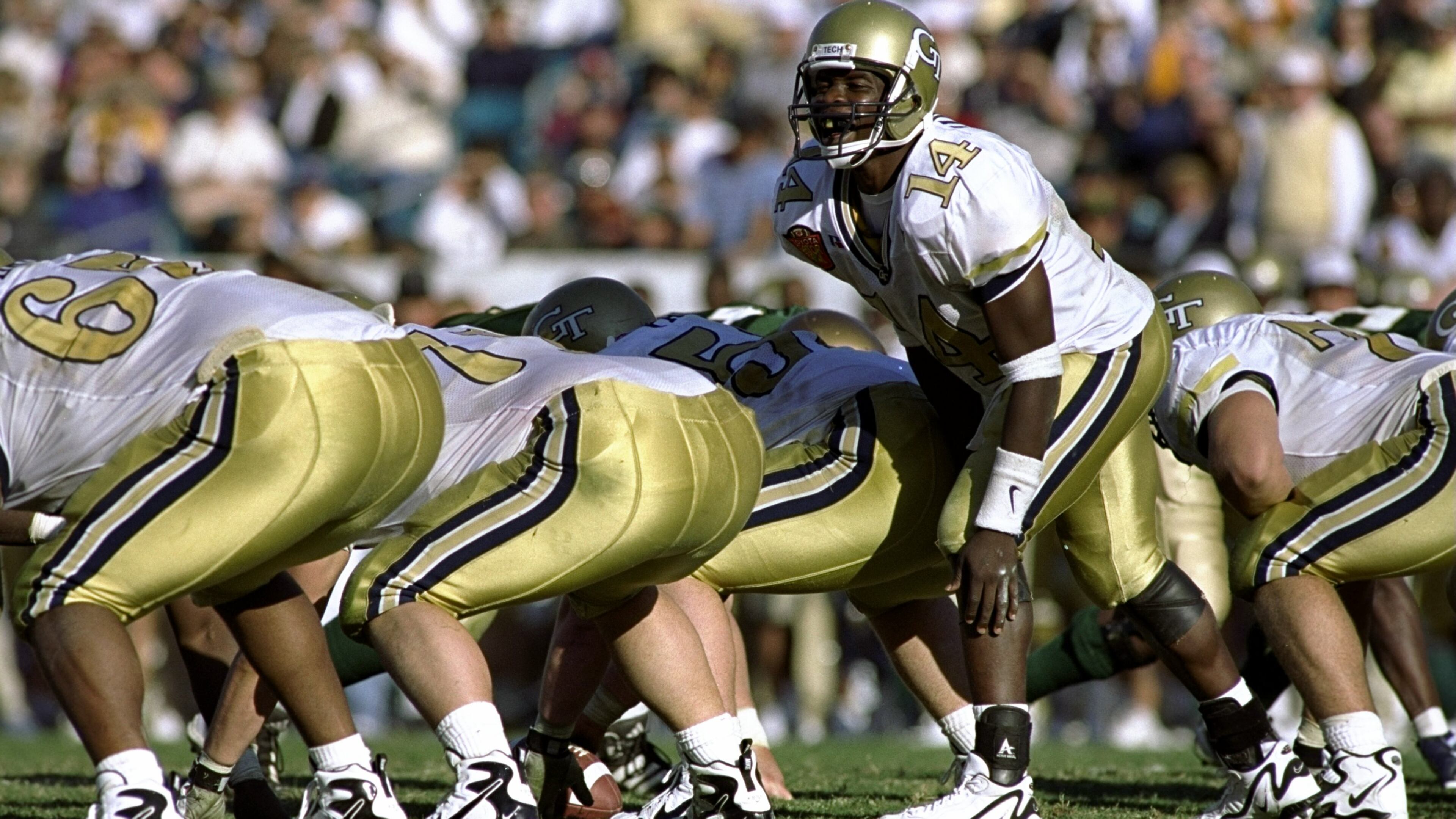1 Jan 1999: Joe Hamilton #14 of the Georgia Tech Yellow Jackets calls from the line of scrimmage during the Toyota Gator Bowl against the Notre Dame Fighting Irish at Alltel Stadium in Jacksonville, Florida. Georgia Tech defeated Notre Dame 35-28. Mandatory Credit: Craig Jones /Allsport