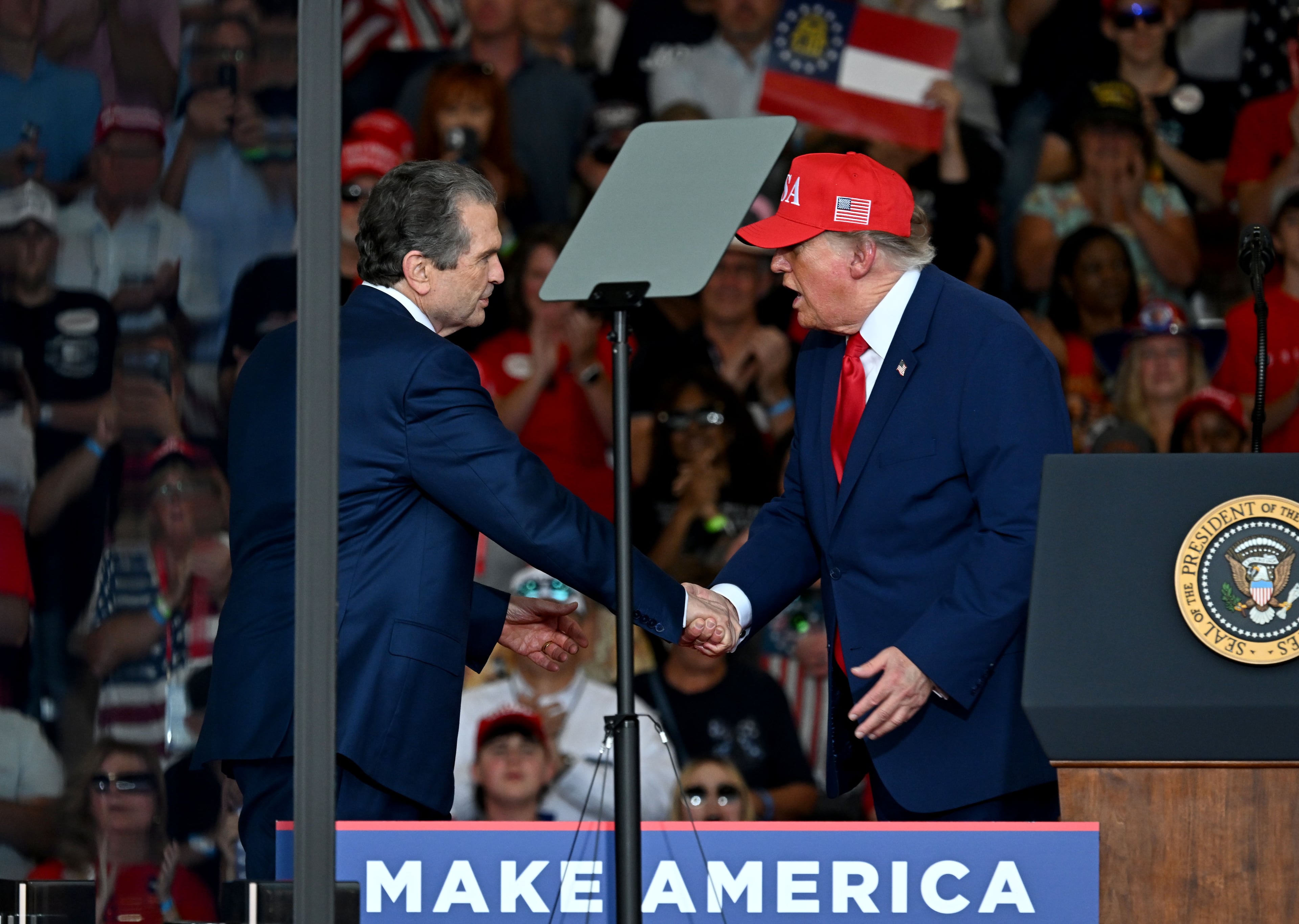 Georgia Republican governor nominee Rick Jackson is greeted by President Donald Trump during a campaign rally at Dalton Municipal Airport on Friday, Oct. 16, 2026, in Dalton. (Hyosub Shin/AJC)