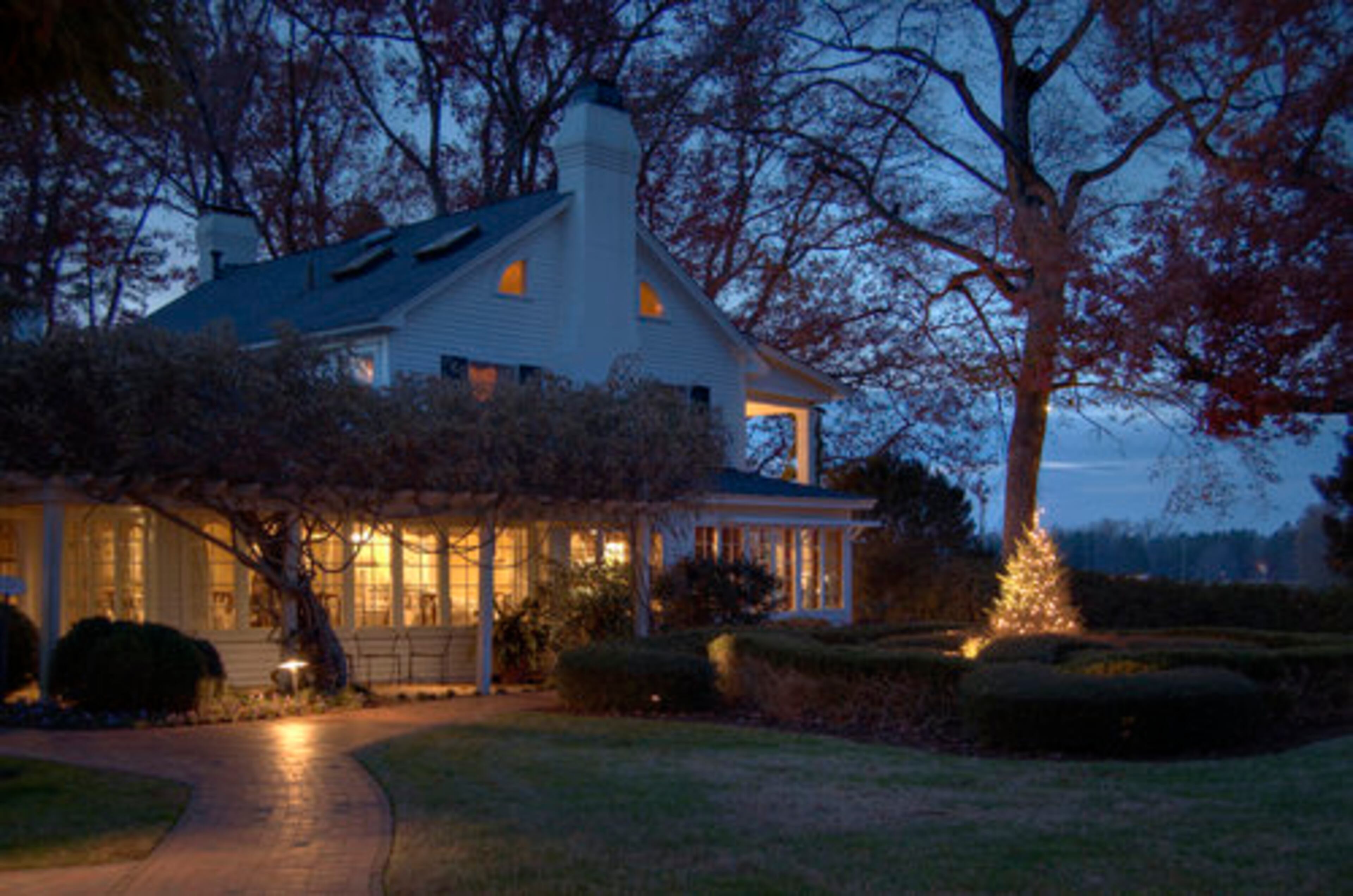 FEARRINGTON HOUSE COUNTRY INN, Pittsboro, N.C.: The inn dates to 1986 but was designed to complement the Fearrington House restaurant, which was built as the Fearrington family homestead in the 1920s. Enjoy the rural-esque, wood-construction charm. Readers of Travel + Leisure magazine rank it as one of the 100 top hotels in the world. Around the holidays, the Fearrington Village center is decorated with cut trees wrapped in traditional white lights for a romantic, European feel.