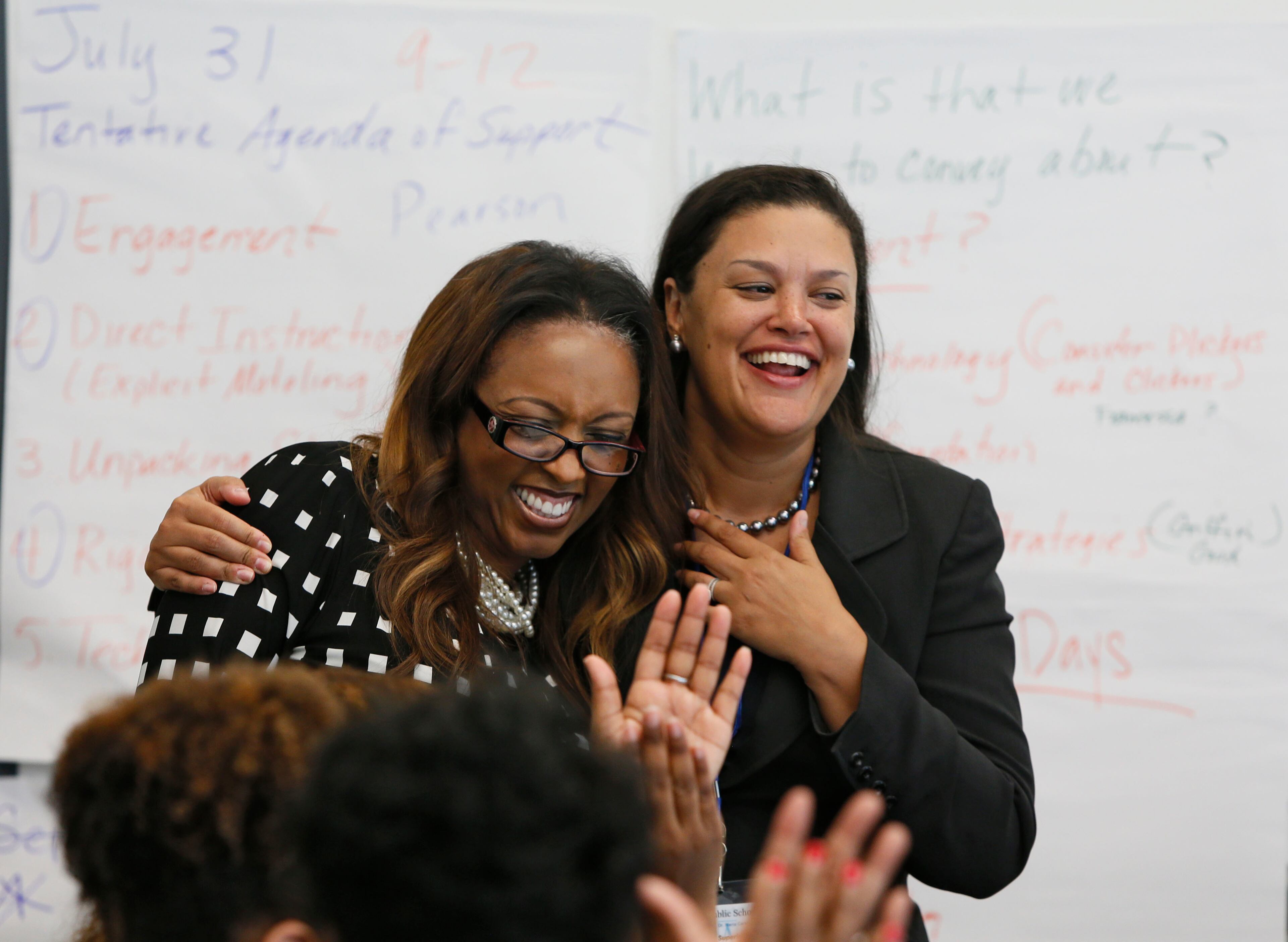 July 7, 2014 - Atlanta - Meria Carstarphen (right) and principal Shelly Powell (left) met briefly with the summer planning team at Daniel McLaughlin Therrell High School. The first day mood was jovial. Monday was new Atlanta Public Superintendent Meria Carstarphen’s first official day on the job, which started with a staff meeting at APS offices and included a visit to Daniel McLaughlin Therrell High School. BOB ANDRES / BANDRES@AJC.COM