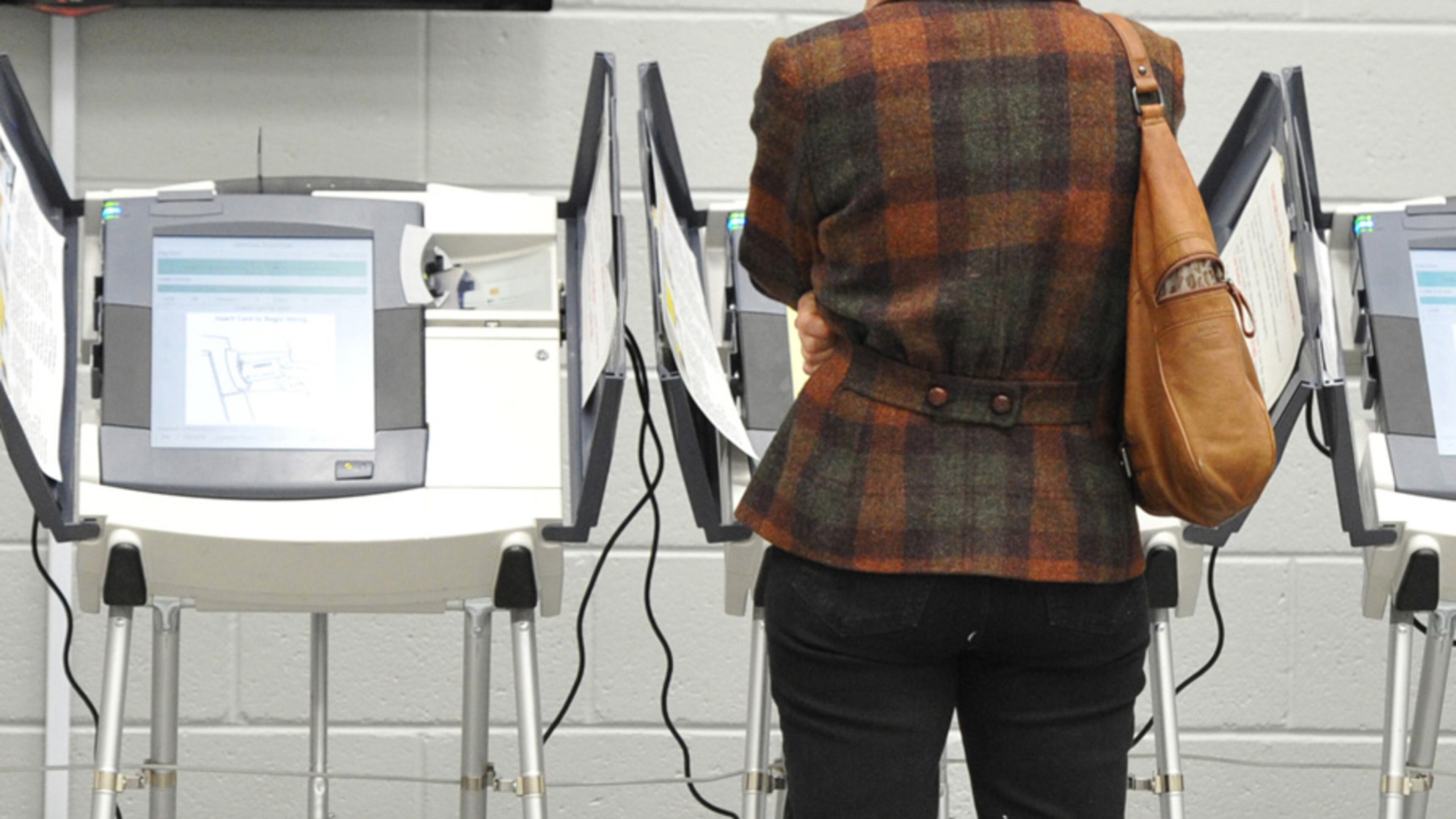 An early voter casts her ballot at Adamsville Recreation Center, an early voting site, in Atlanta on Friday, May 2, 2014.
