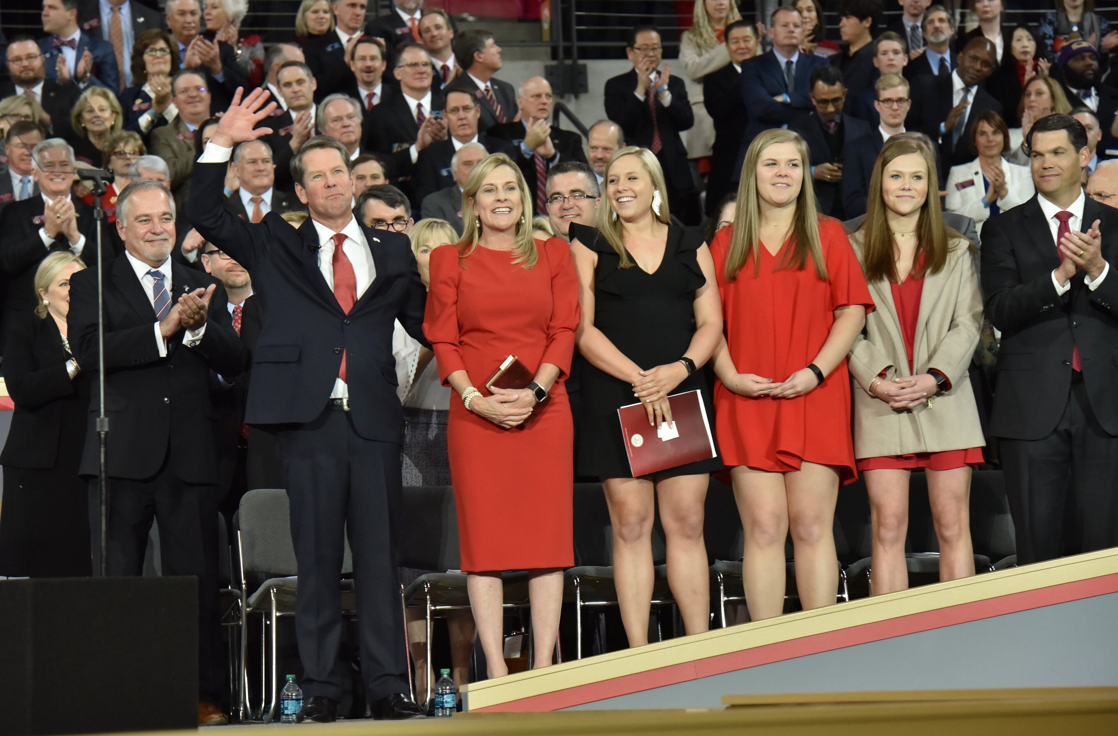January 14, 2019 Atlanta - Brian Kemp with wife Marty Kemp and daughters Jarrett, Lucy, and Amy Porter, waves to supporters during the swearing-in ceremony at McCamish Pavilion in Campus of Georgia Tech on Monday, January 14, 2019. HYOSUB SHIN / HSHIN@AJC.COM