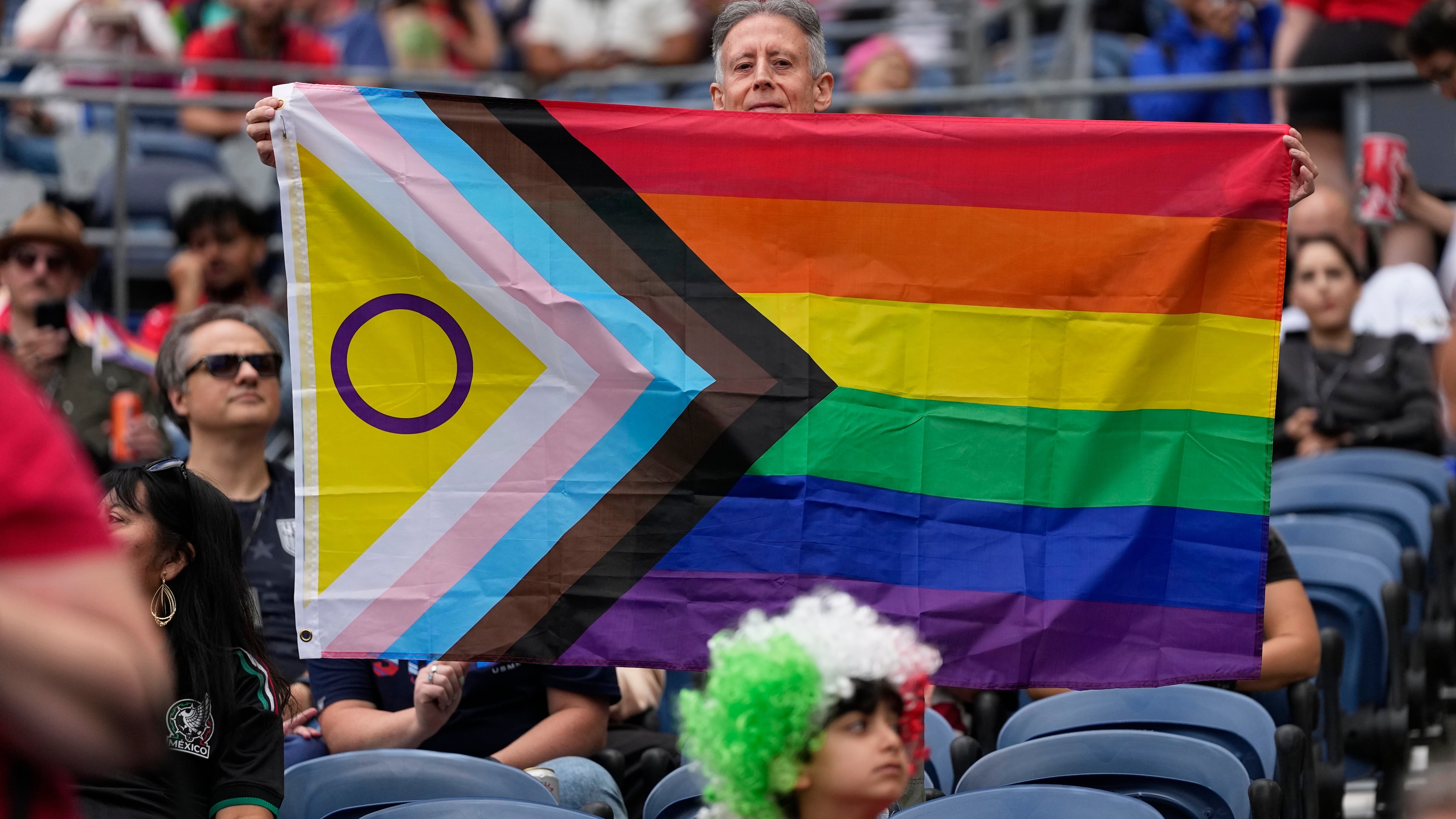 A spectator holds up a flag before the start of the World Cup Group G soccer match between Egypt and Iran in Seattle, Friday, June 26, 2026. (AP Photo//Lindsey Wasson)