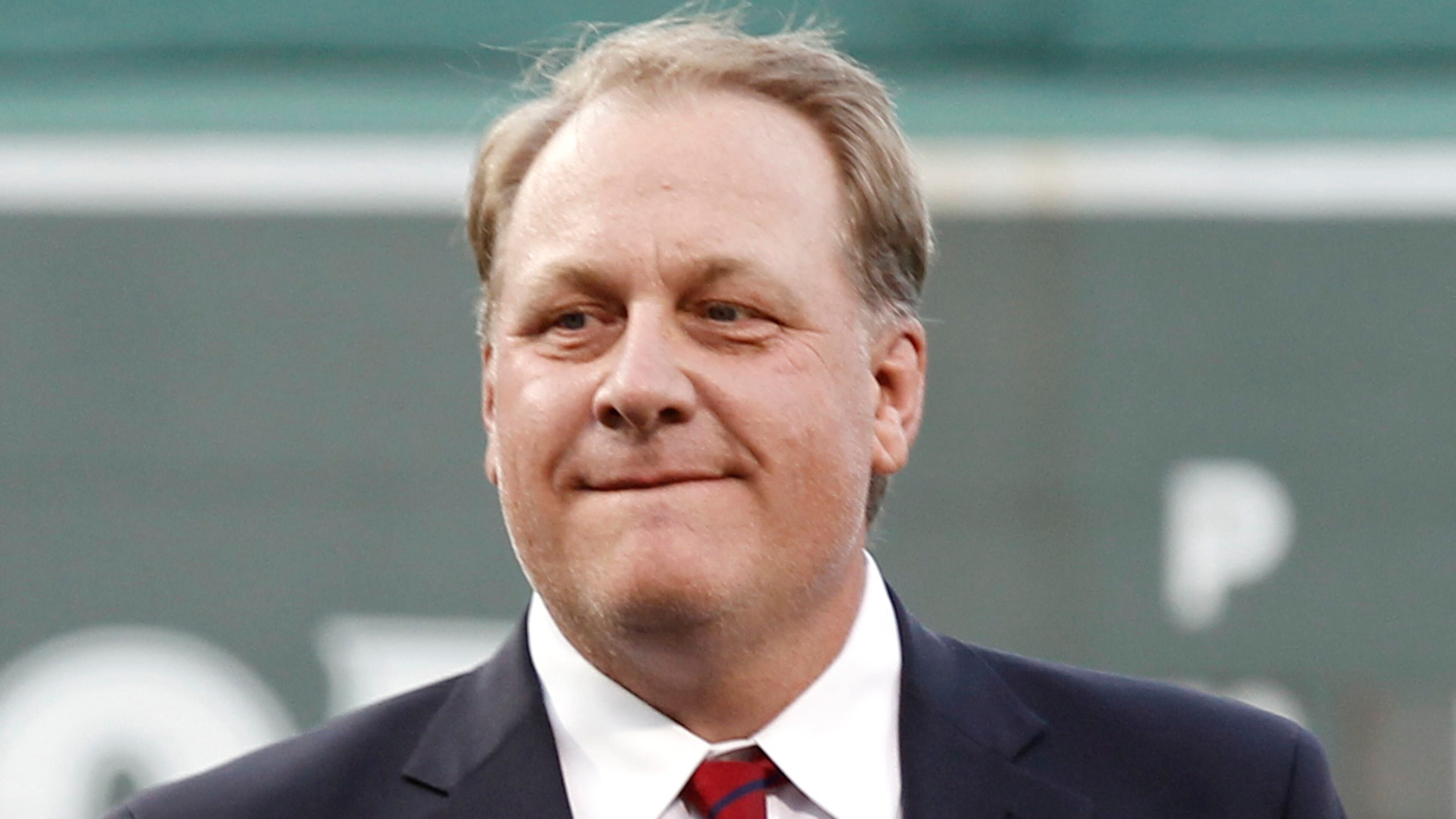 In this Aug. 3, 2012, file photo, former Boston Red Sox pitcher Curt Schilling looks on after being introduced as a new member of the Boston Red Sox Hall of Fame before a baseball game between the Red Sox and the Minnesota Twins at Fenway Park in Boston. Schilling is defending himself after making comments on social media about transgender people, saying he was expressing his opinion.