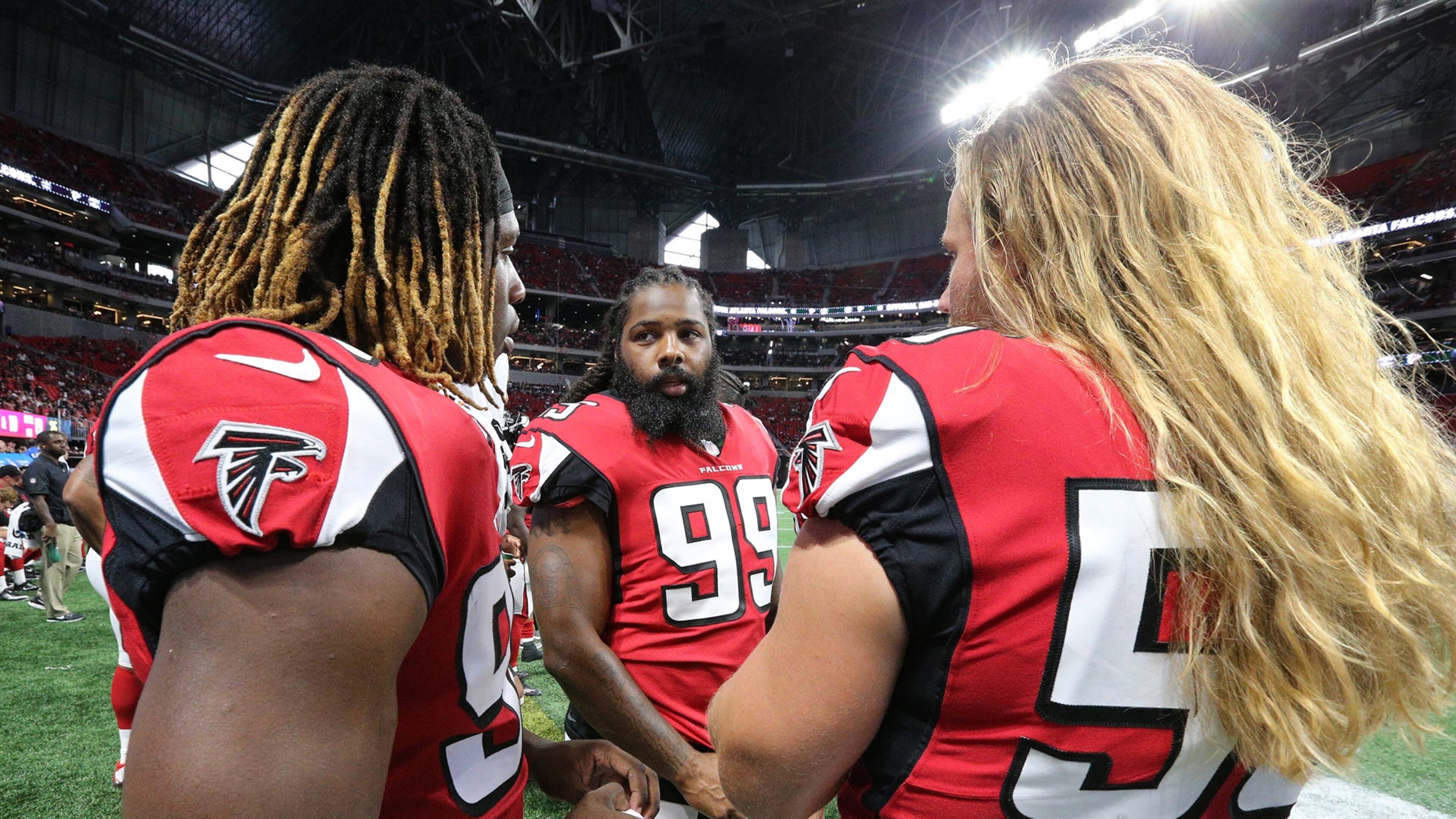 August 31, 2017 Atlanta: Falcons Takkarist McKinley (from left), Adrian Clayborn, and Brooks Reed confer on the sidelines against the Jaguars in a NFL preseason football game on Thursday, August 31, 2017, in Atlanta. They will now be counted on to replace Vic Beasley, who set to miss at least one game and perhaps a few more. Curtis Compton/ccompton@ajc.com