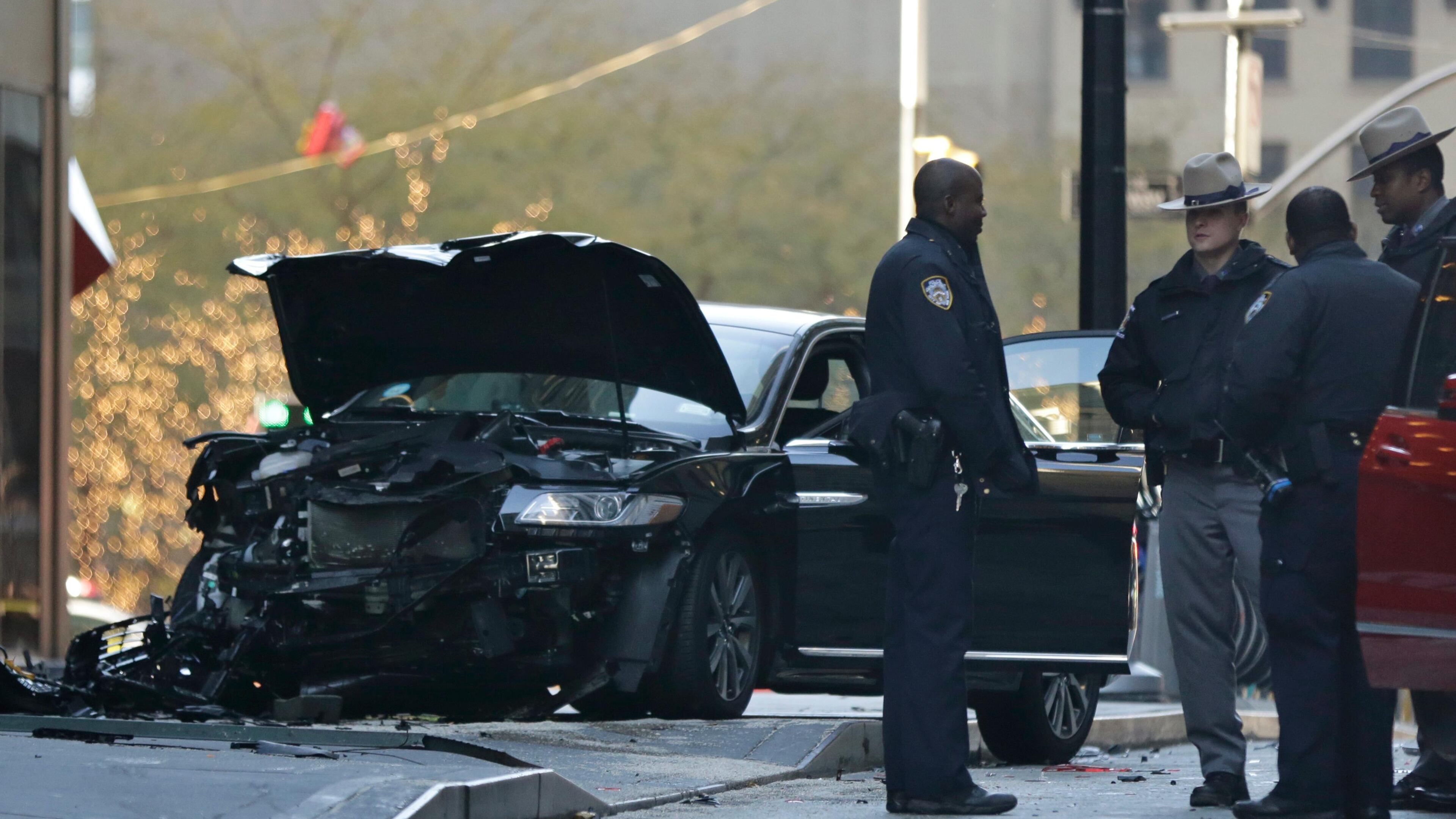 Police gather at the scene of an accident near Broadway and Liberty Street in New York on Thursday, Dec. 7, 2017. Police say six people were hurt in the accident involving three vehicles just blocks from the World Trade Center in Lower Manhattan. (AP Photo/Peter Morgan)