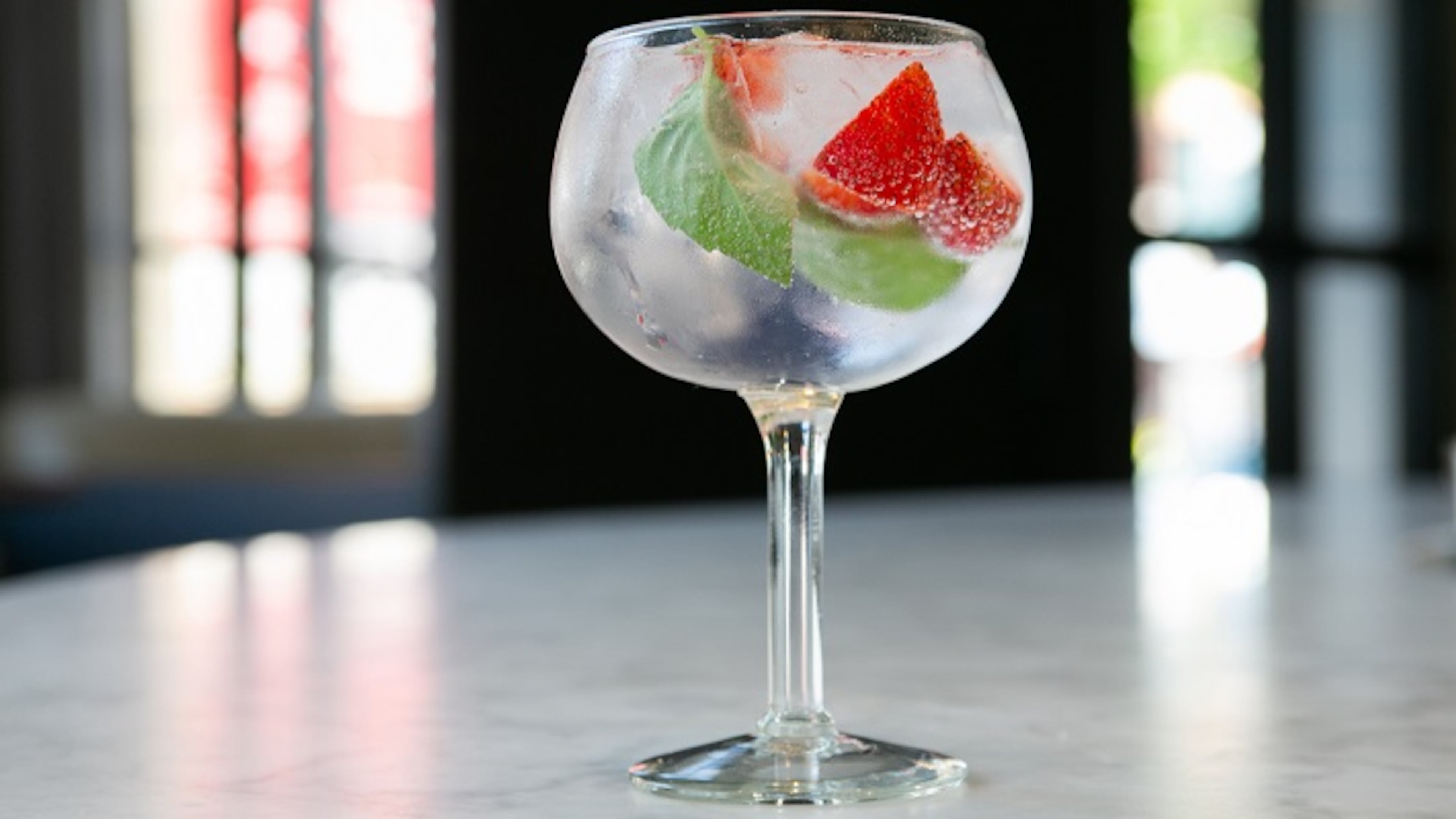 Proxi head bartender Josh Relkin offers four gin tonic variations on his cocktail menu, including strawberry-strewn version featuring Citadelle, a French gin, and pink peppercorns. (Kristan Lieb/Chicago Tribune/TNS)