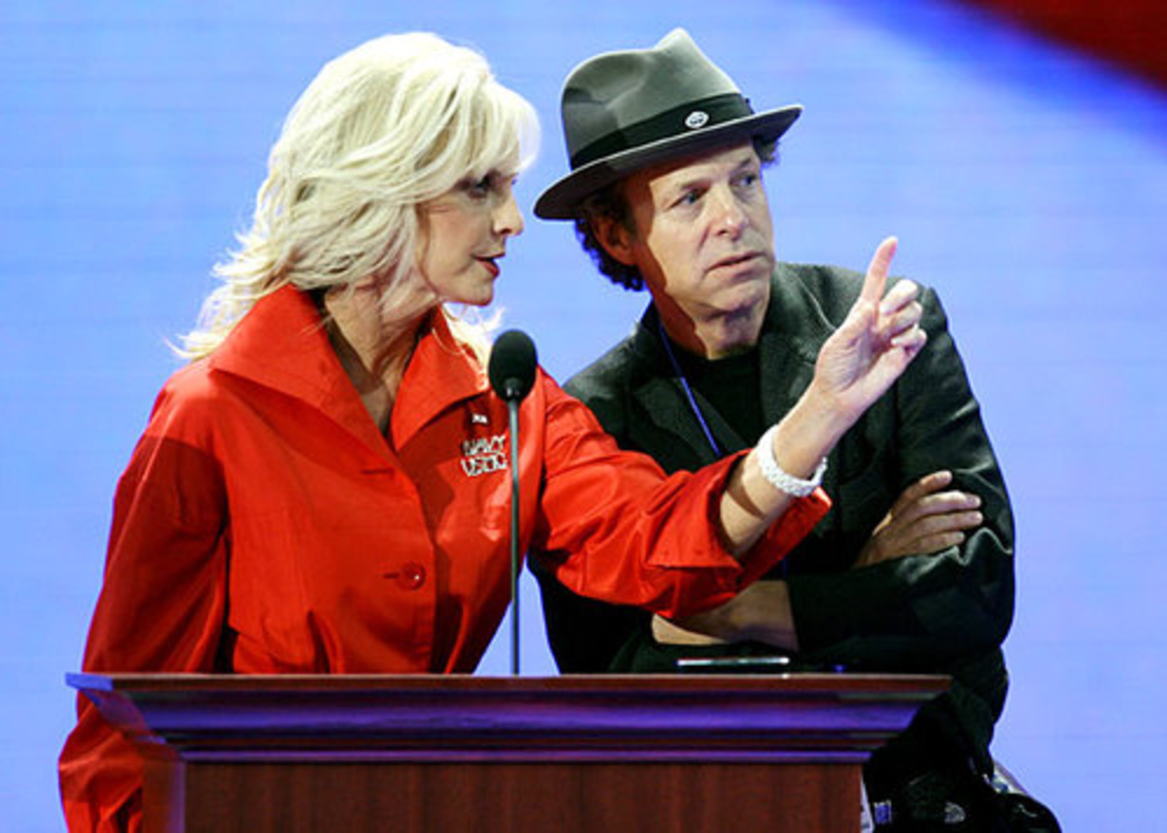 McCain checks out the convention hall's podium Wednesday with an adviser. "She appreciates very well-made clothes and that have rich, luxurious fabrics," said Sasha Iglehart, Glamour magazine's Deputy Fashion Director. "Such clothes could wear the person and she seems to be able to carry it off."