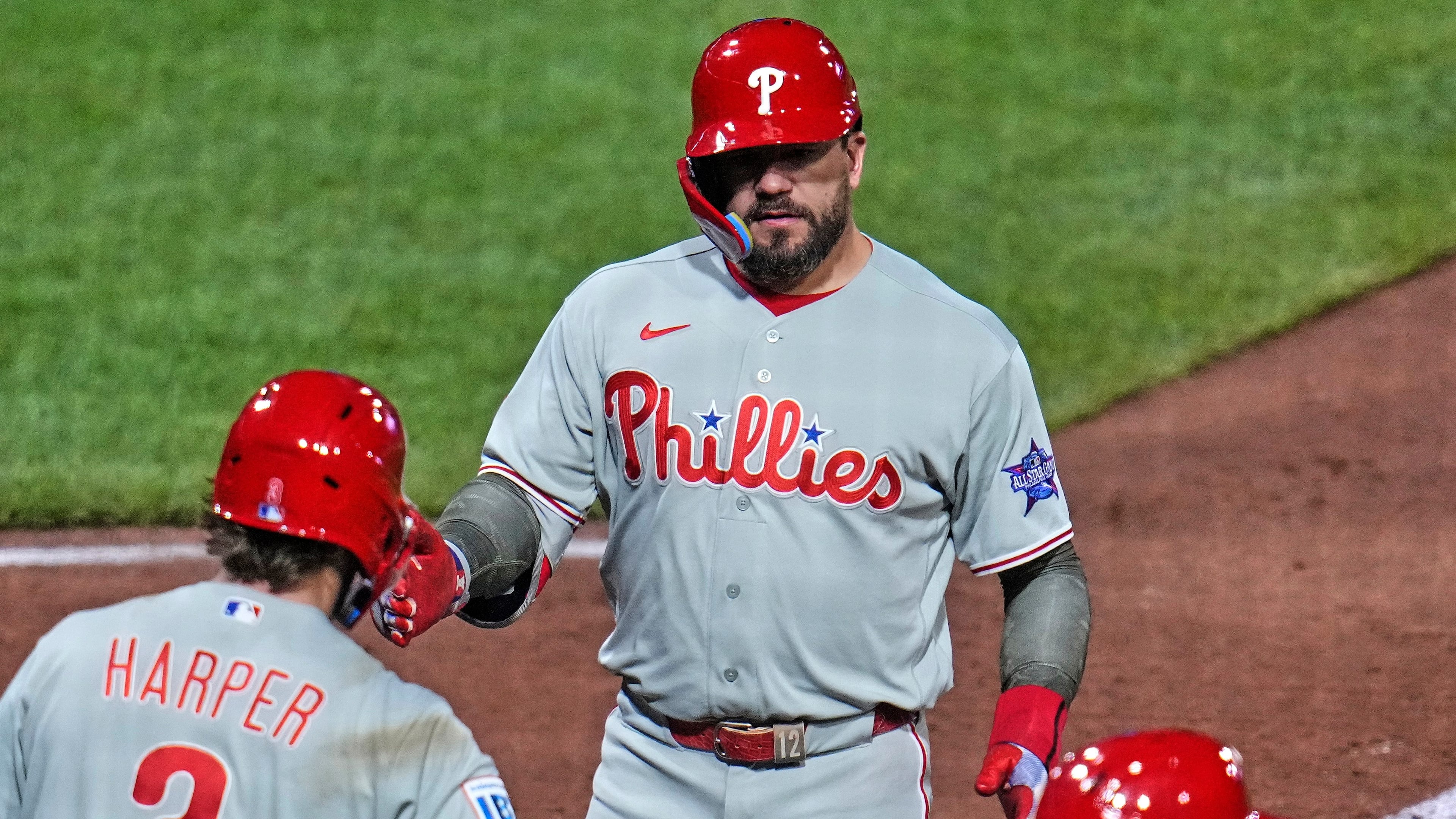 Philadelphia Phillies' Kyle Schwarber, top, is greeted by Bryce Harper (3) as he crosses home plate after hitting a two-run home run off Pittsburgh Pirates pitcher Mason Montgomery during the seventh inning of a baseball game in Pittsburgh, Friday, May 15, 2026. (AP Photo/Gene J. Puskar)