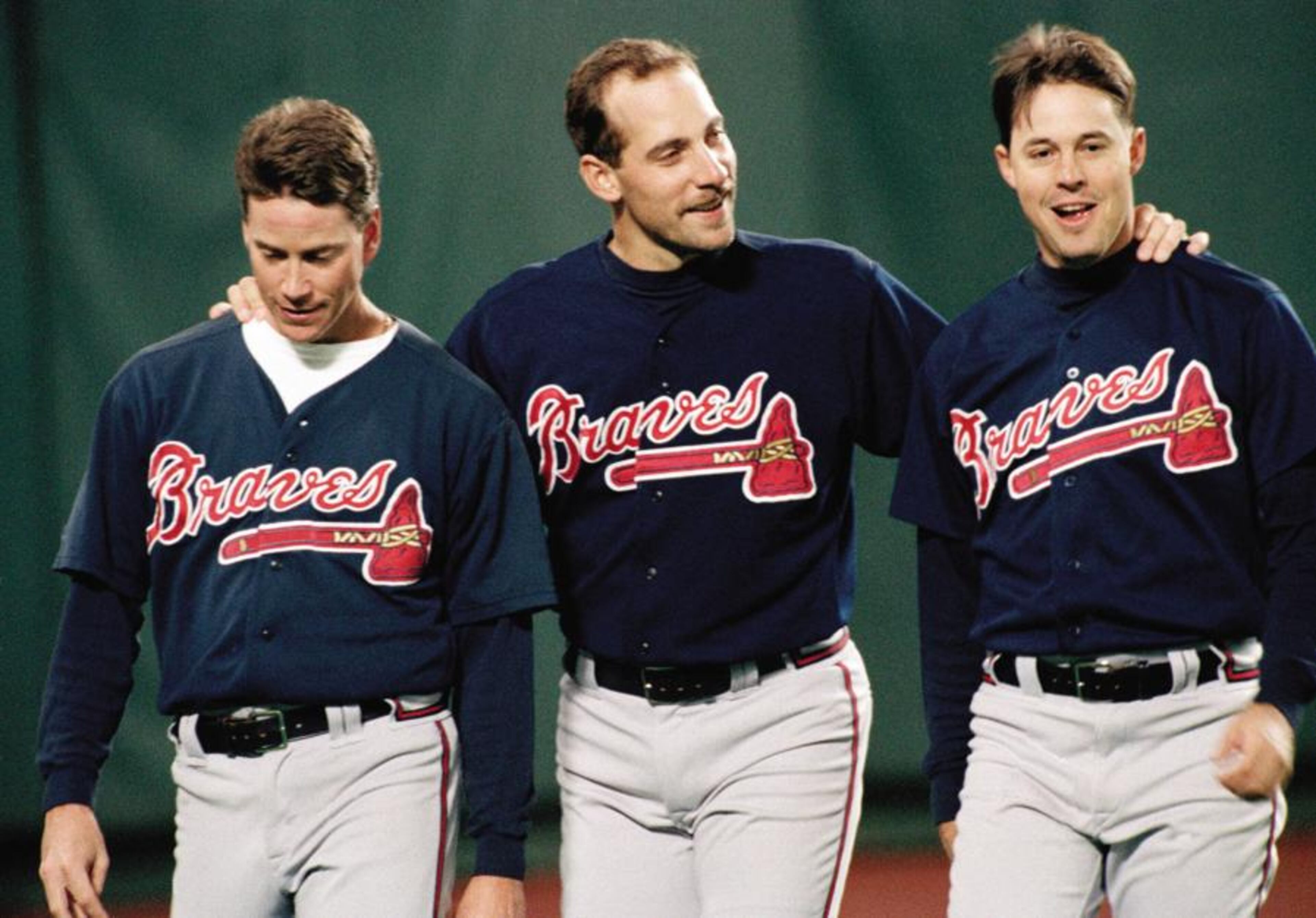 Braves pitchers (from left) Tom Glavine, John Smoltz and Greg Maddux have a moment together before their game with Philadelphia Phillies at Veterans Stadium, on Oct. 6, 1993.
