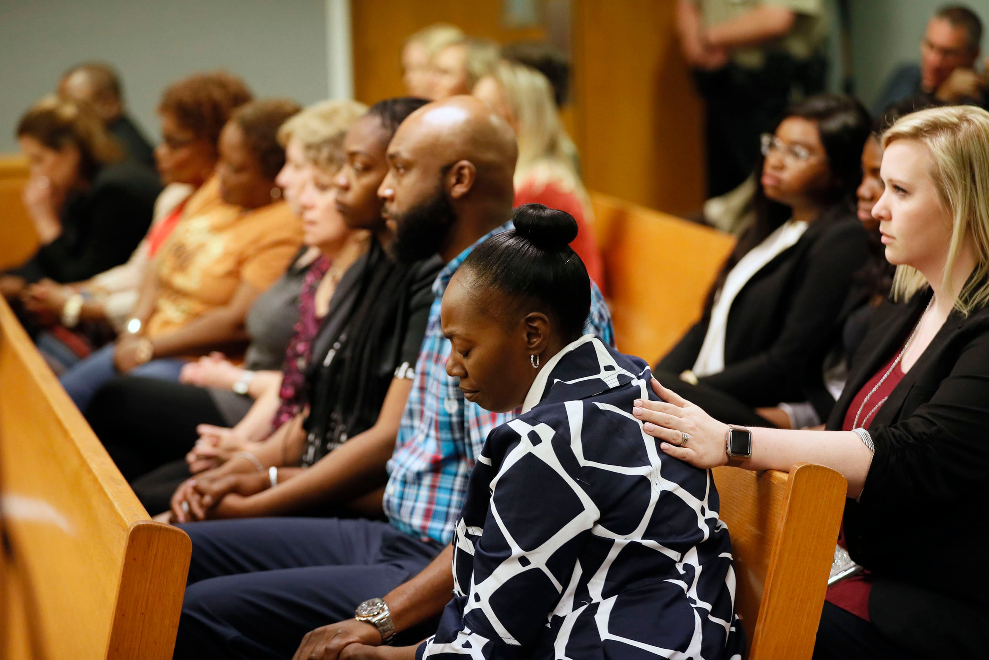 April 30, 2019 - Lawrenceville - Robin Moss (front), Emani's grandmother, and others, including family members and Emani's fourth grade teacher, react to the verdict. The jury in the Tiffany Moss murder trial today sentenced her to death after they found Moss, who is representing herself, guilty of intentionally starving her 10-year-old stepdaughter Emani to death in the fall of 2013, in addition to other charges. The prosecution is asking for the death penalty. Bob Andres / bandres@ajc.com