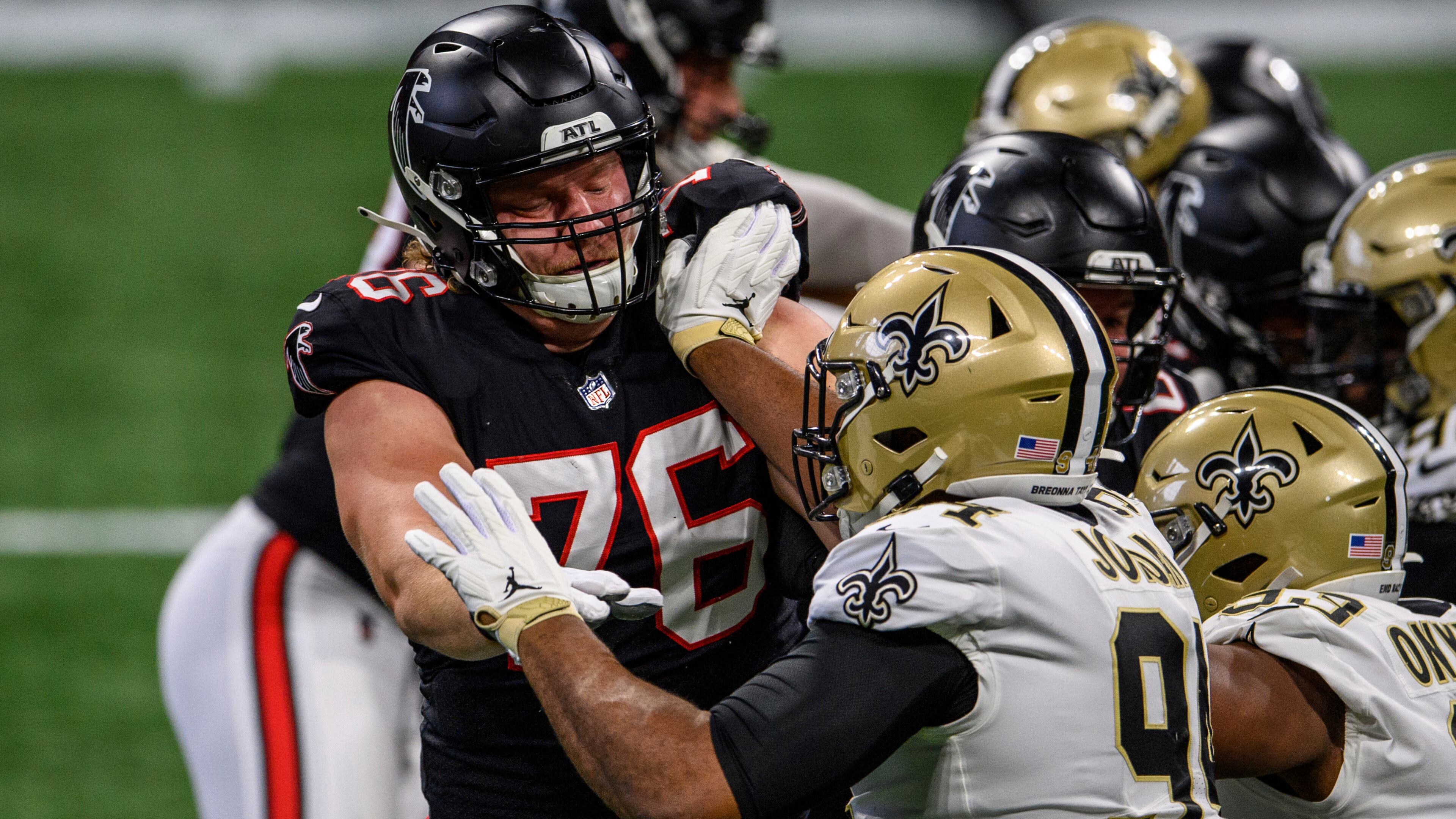 Falcons offensive tackle Kaleb McGary (76) works against New Orleans Saints defensive end Cameron Jordan (94) during the first half Sunday, Dec. 6, 2020, at Mercedes-Benz Stadium in Atlanta. The Saints won 21-16. (Danny Karnik/AP)