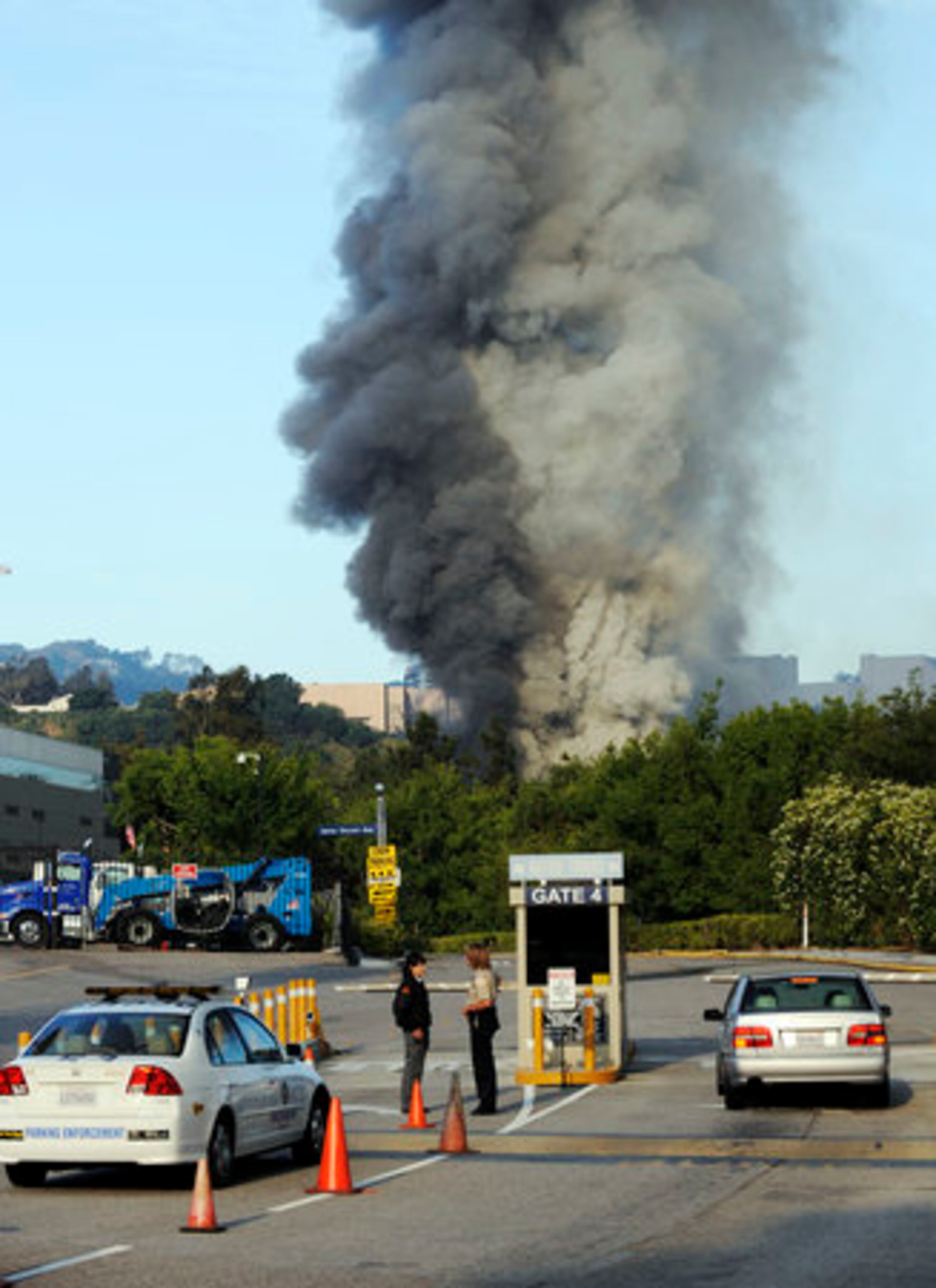 A fire burns in the back lot of Universal City Studios north of Los Angeles Sunday. At least one building had burned and as many as three blocks of movie facades were destroyed, according to Los Angeles County Fire Inspector Daryl Jacobs.