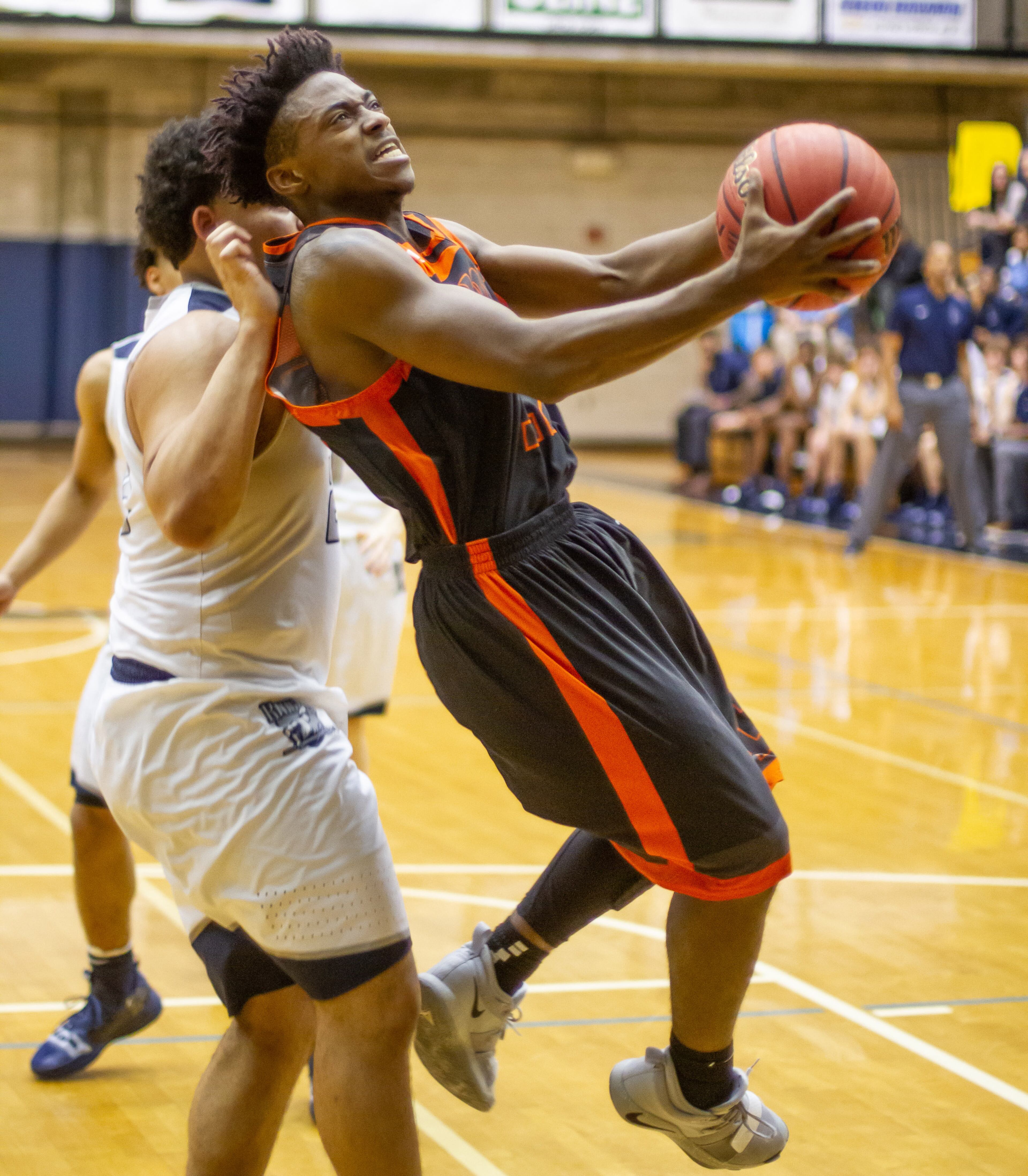Hart County High School basketball player Elijah Robison goes to the basket guarded by Pace Academy High School's Justin Johnson during the first round of the boys' high school basketball state tournament at Pace Academy high school Saturday, February 16, 2019. STEVE SCHAEFER / SPECIAL TO THE AJC