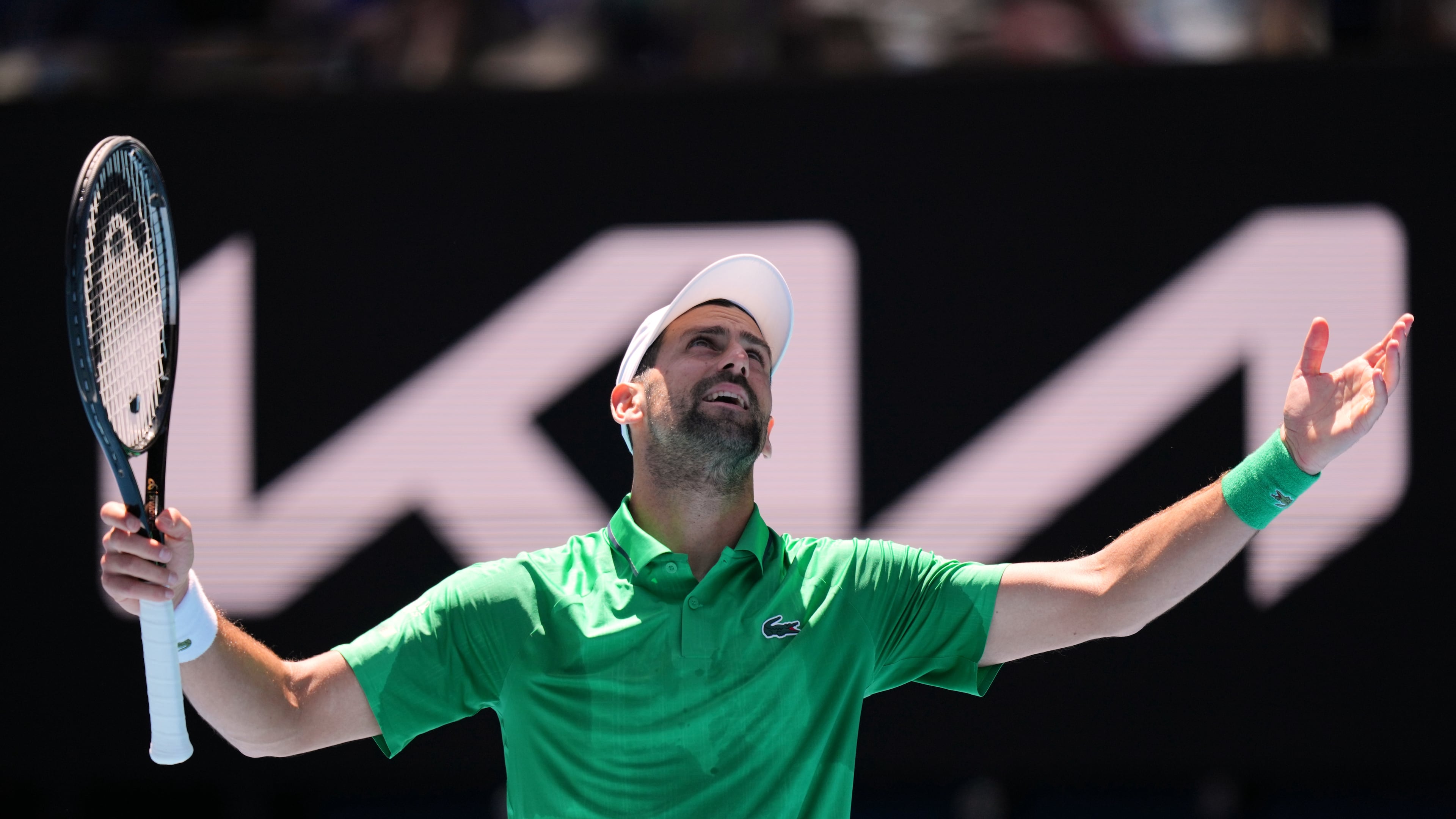 Novak Djokovic of Serbia reacts during his second round match against Francesco Maestrelli of Italy at the Australian Open tennis championship in Melbourne, Australia, Thursday, Jan. 22, 2026. (AP Photo/Aaron Favila)
