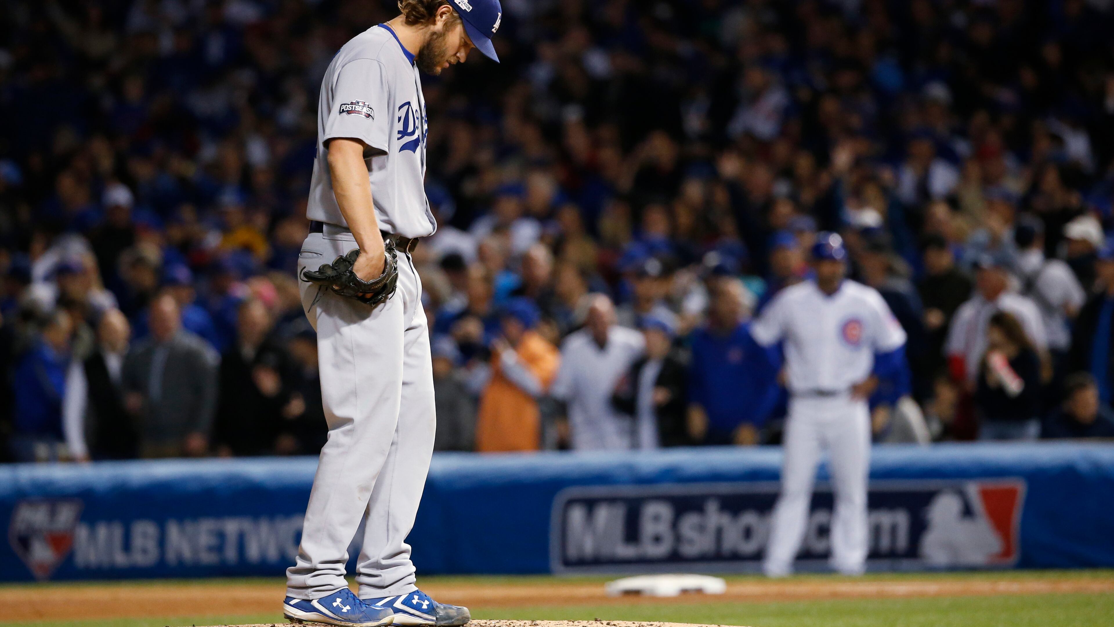 Los Angeles Dodgers starting pitcher Clayton Kershaw (22) looks down as he pitches during the fourth inning of Game 6 of the National League baseball championship series against the Chicago Cubs, Saturday, Oct. 22, 2016, in Chicago. (AP Photo/Nam Y. Huh)