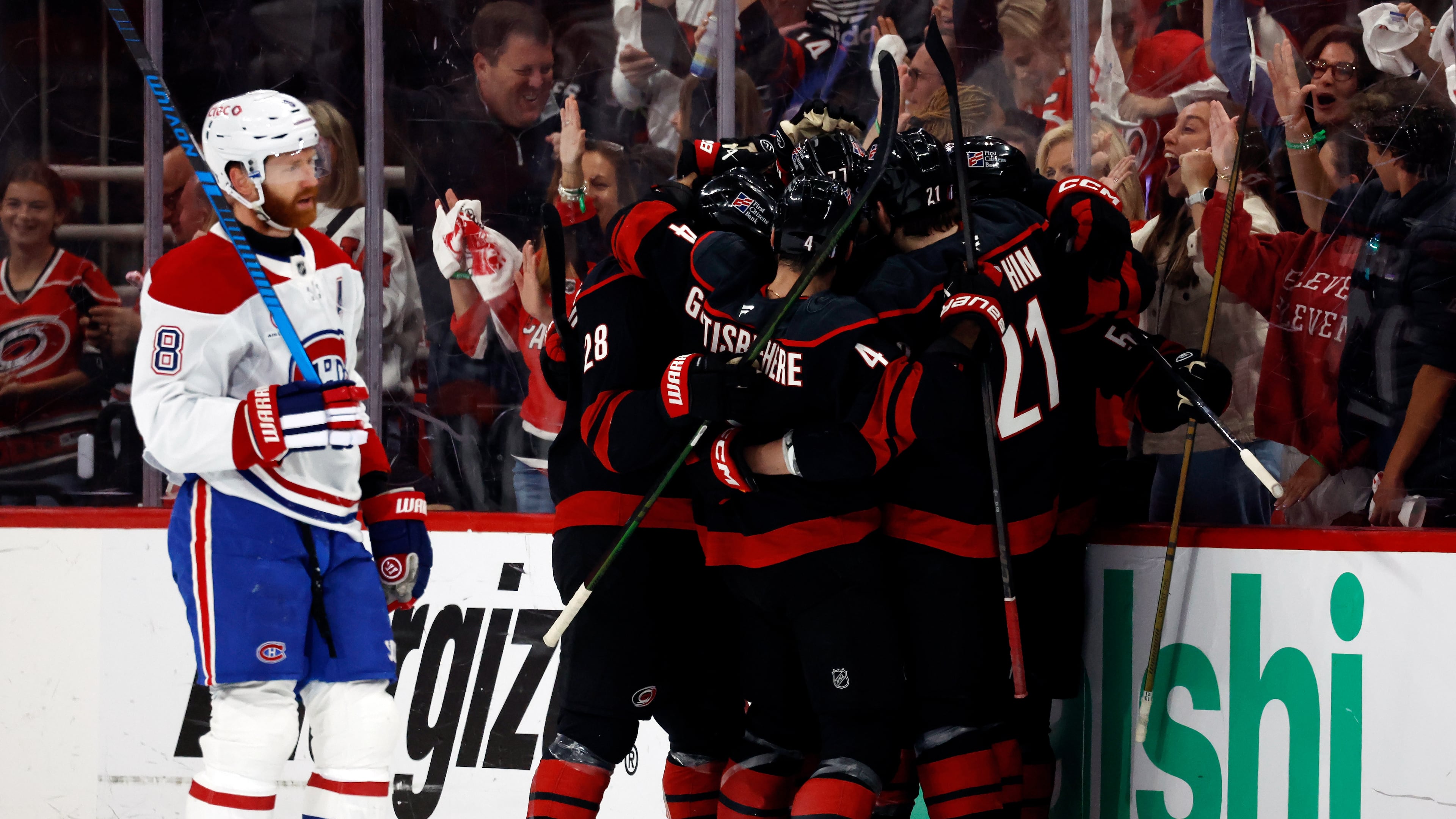 Carolina Hurricanes players celebrate after a goal by Eric Robinson as Montreal Canadiens' Mike Matheson (8) skates by during the first period in Game 5 of the Eastern Conference finals NHL hockey Stanley Cup playoff series in Raleigh, N.C., Friday, May 29, 2026. (AP Photo/Karl DeBlaker)